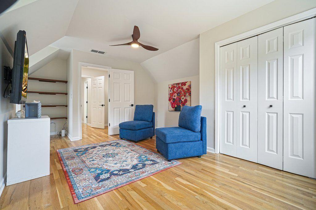 4110 Providence Square Alpharetta, GA 30009 - Photo 39 of 73 a living room with furniture and a wooden floor