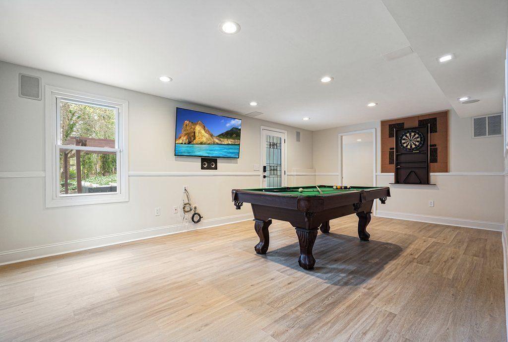 4110 Providence Square Alpharetta, GA 30009 - Photo 44 of 73 a room with furniture pool table wooden floor and windows
