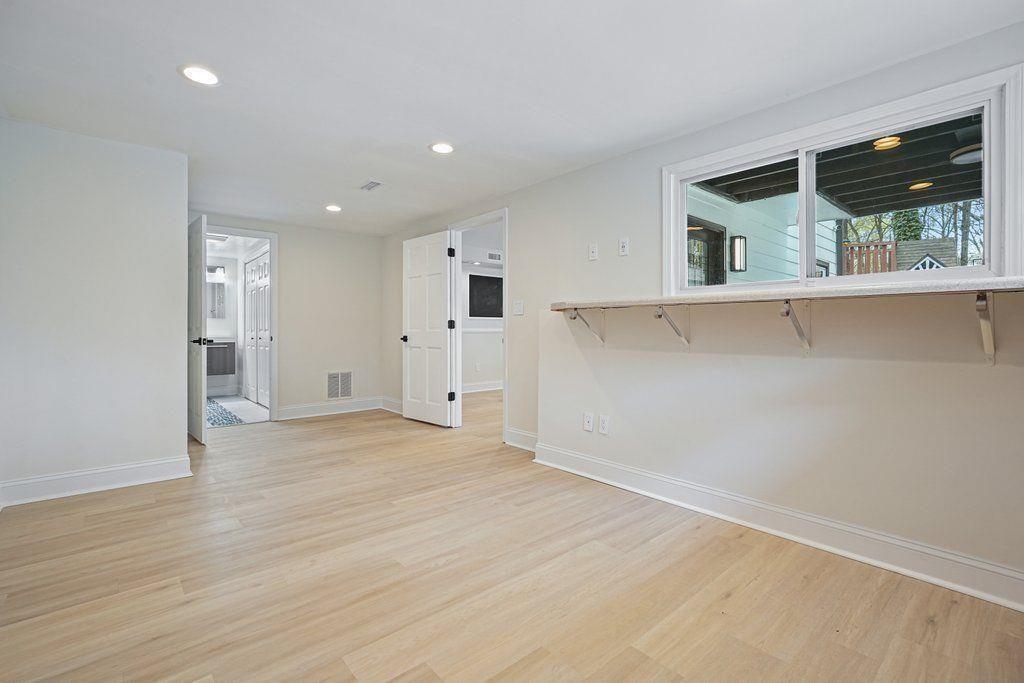 4110 Providence Square Alpharetta, GA 30009 - Photo 45 of 73 a view of an empty room with wooden floor and a window
