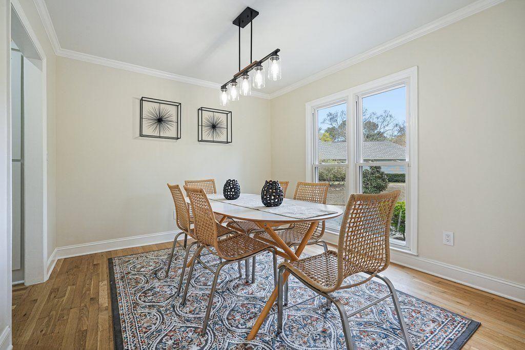 4110 Providence Square Alpharetta, GA 30009 - Photo 6 of 73 a dining room with furniture a rug and wooden floor