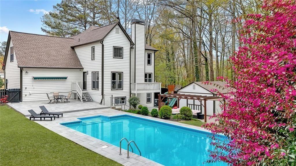 4110 Providence Square Alpharetta, GA 30009 - Photo 63 of 73 a front view of a house with swimming pool having outdoor seating