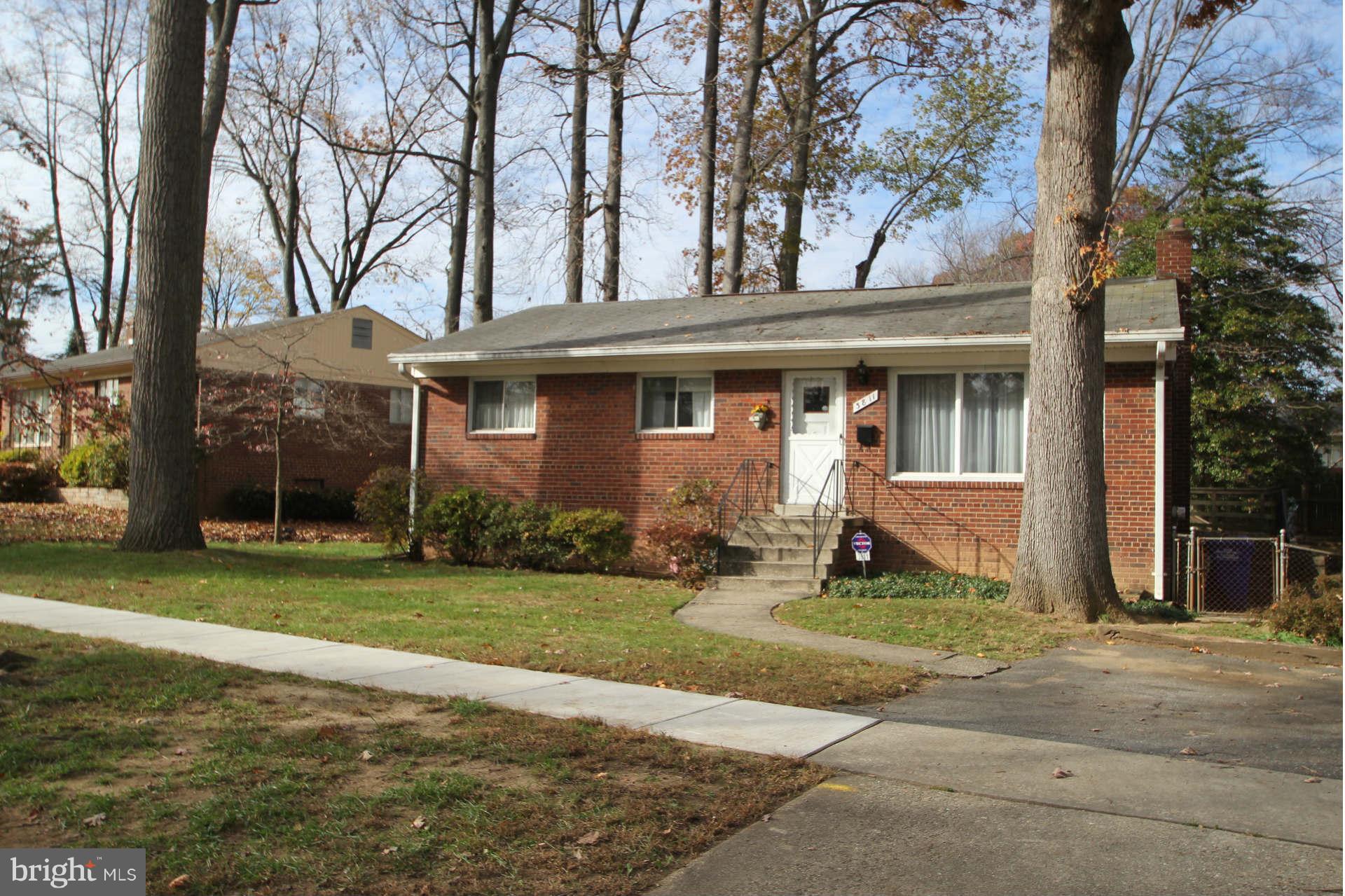 3811 Kayson Street Silver Spring, MD 20906 - Photo 2 of 30 a front view of a house with a yard and trees
