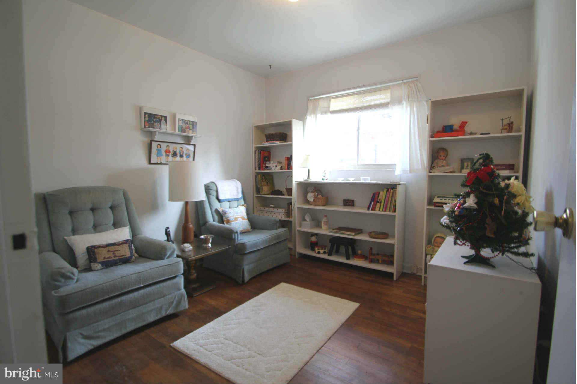 3811 Kayson Street Silver Spring, MD 20906 - Photo 11 of 30 a living room with furniture and a window