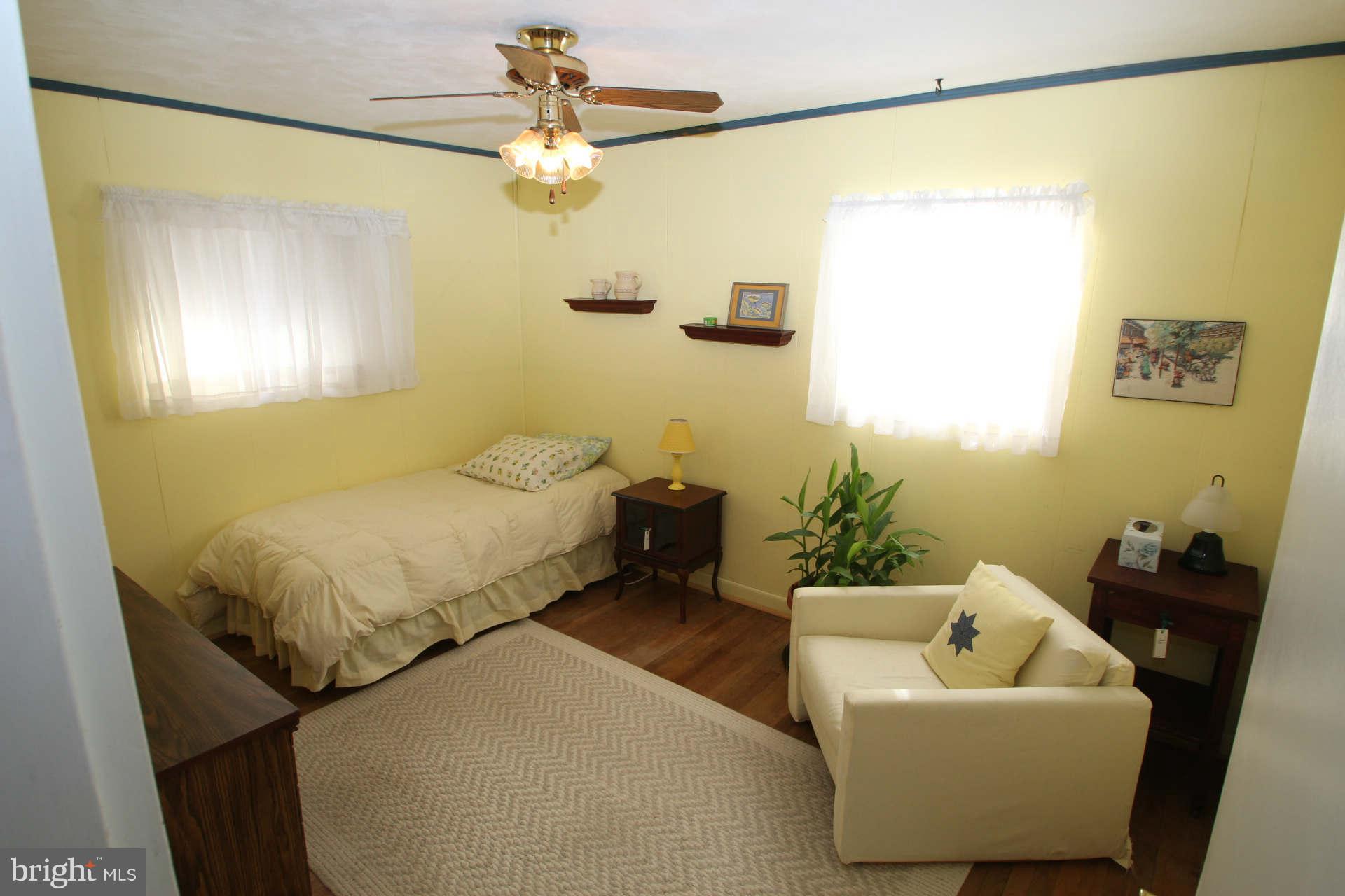 3811 Kayson Street Silver Spring, MD 20906 - Photo 15 of 30 a bedroom with a bed and a couch