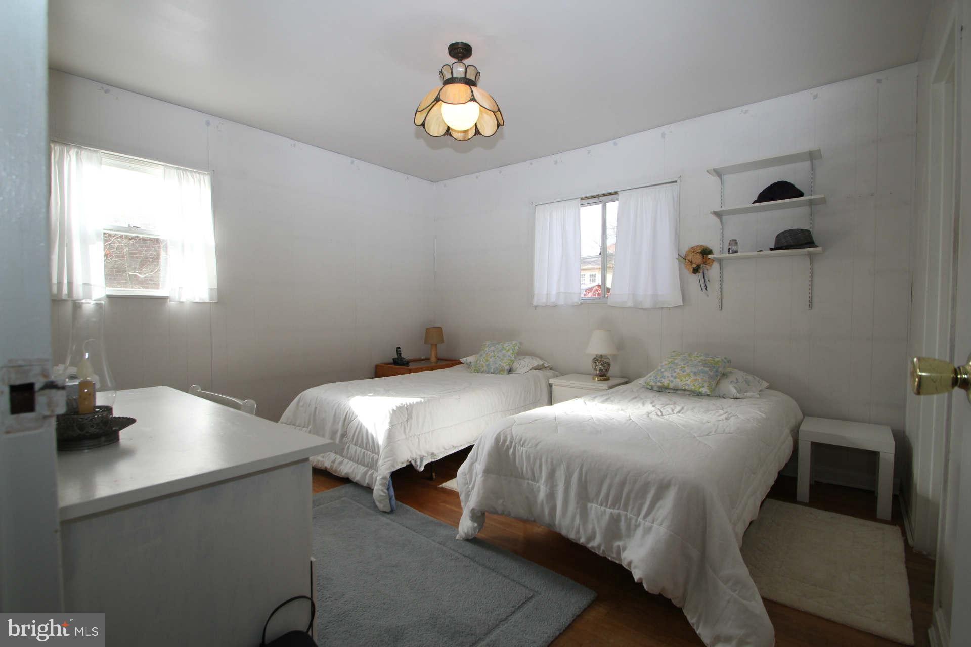 3811 Kayson Street Silver Spring, MD 20906 - Photo 17 of 30 a bedroom with two beds and a window