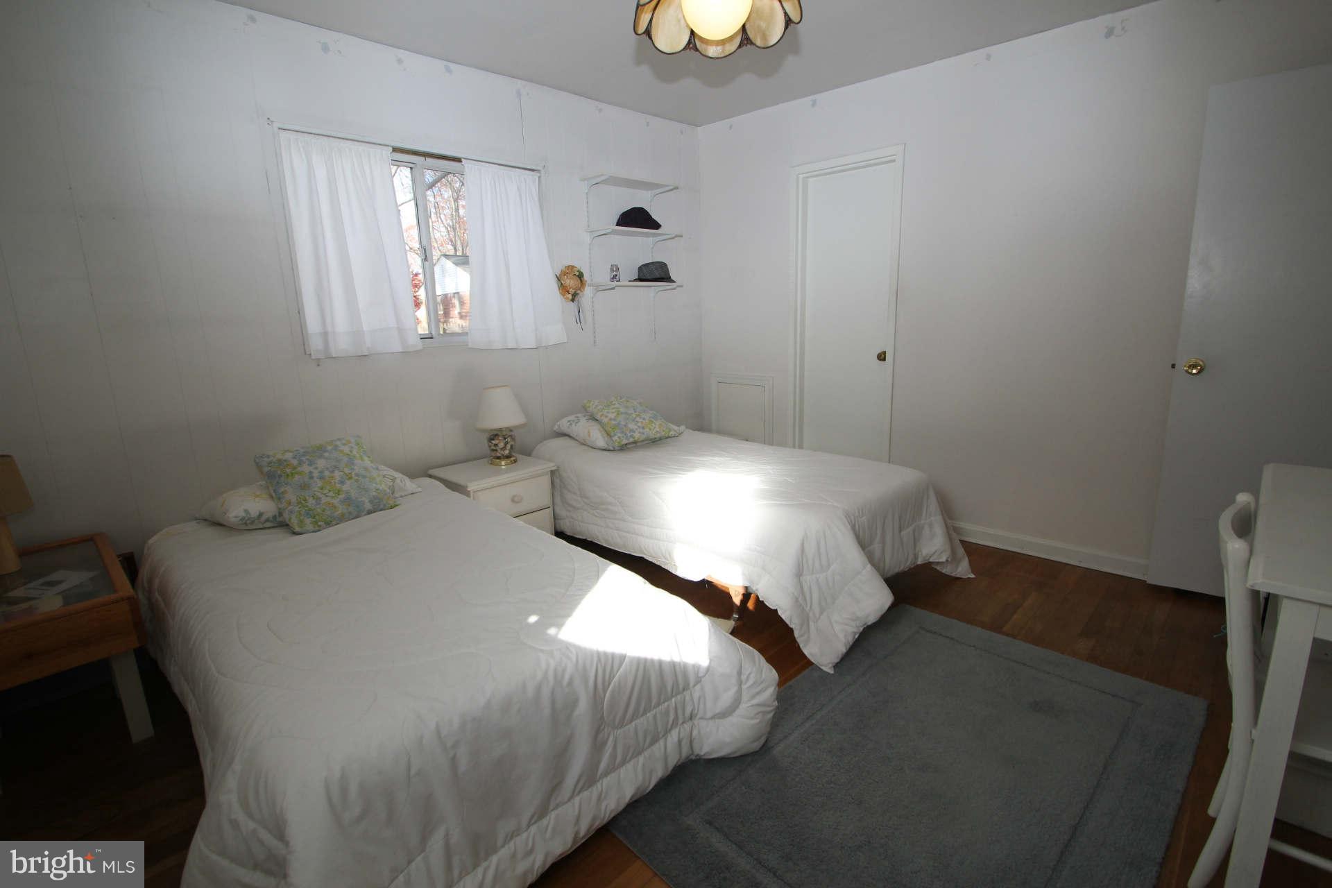 3811 Kayson Street Silver Spring, MD 20906 - Photo 18 of 30 a bedroom with a bed and a window