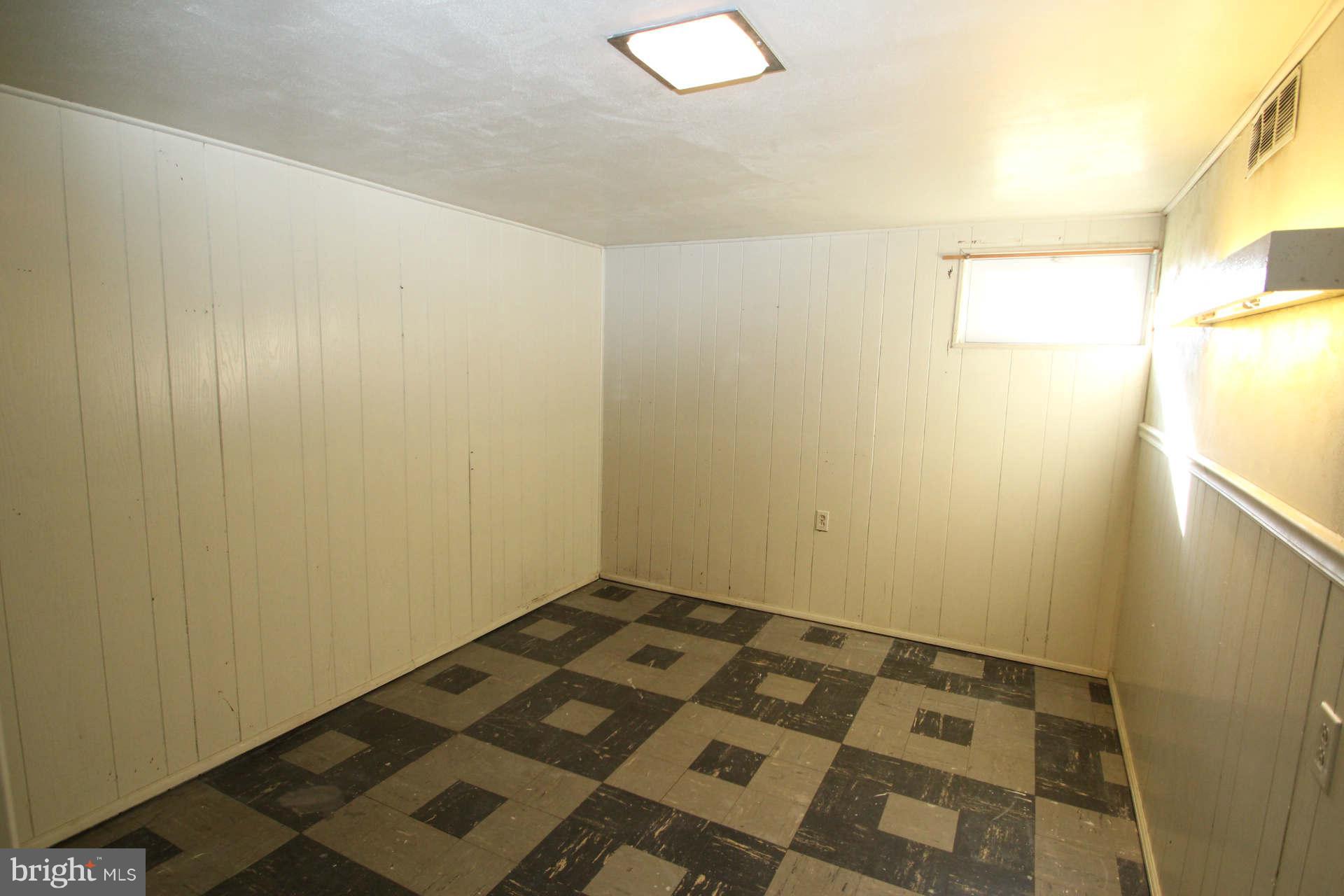 3811 Kayson Street Silver Spring, MD 20906 - Photo 20 of 30 a view of a room with wooden floor and white walls