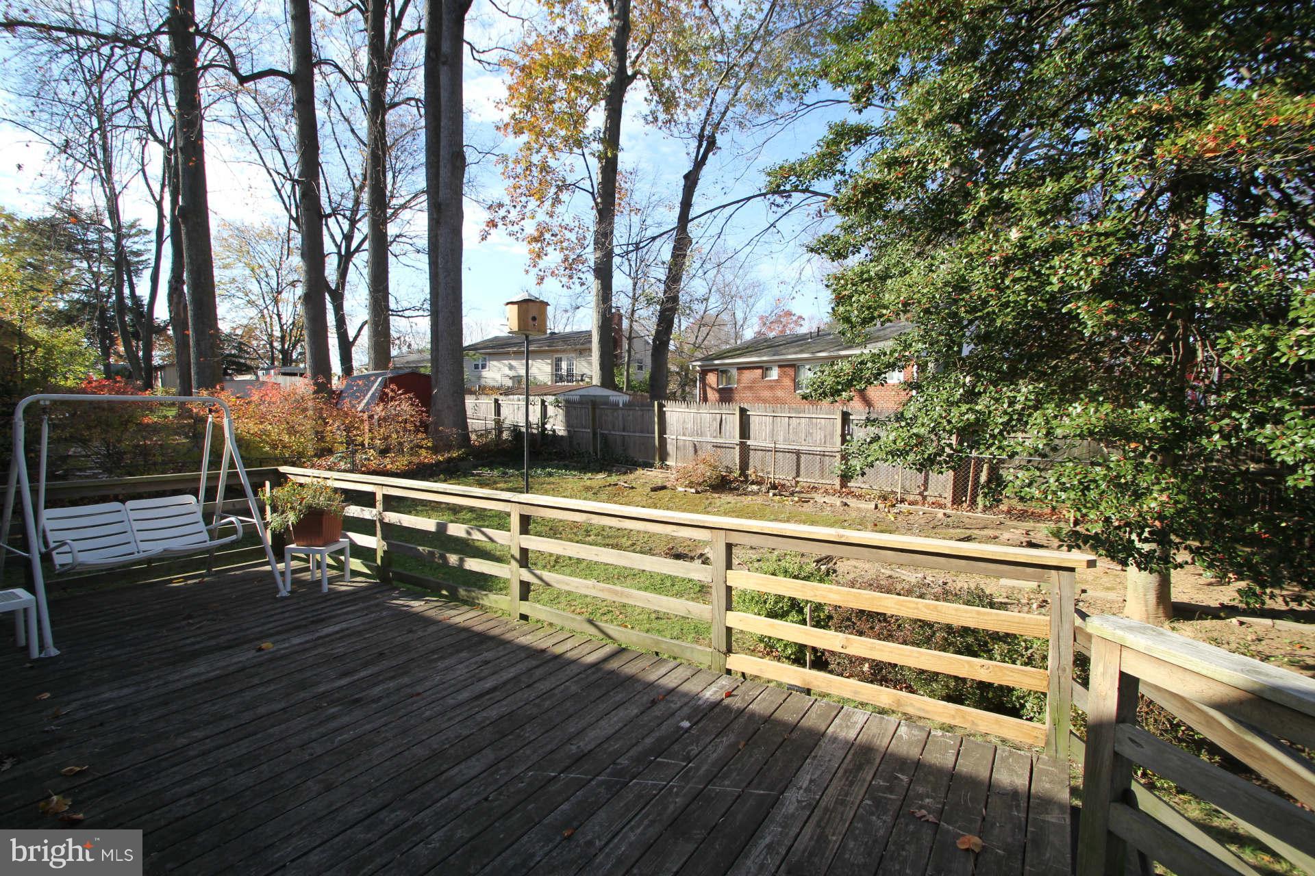 3811 Kayson Street Silver Spring, MD 20906 - Photo 26 of 30 a view of a house with large pool and sitting area