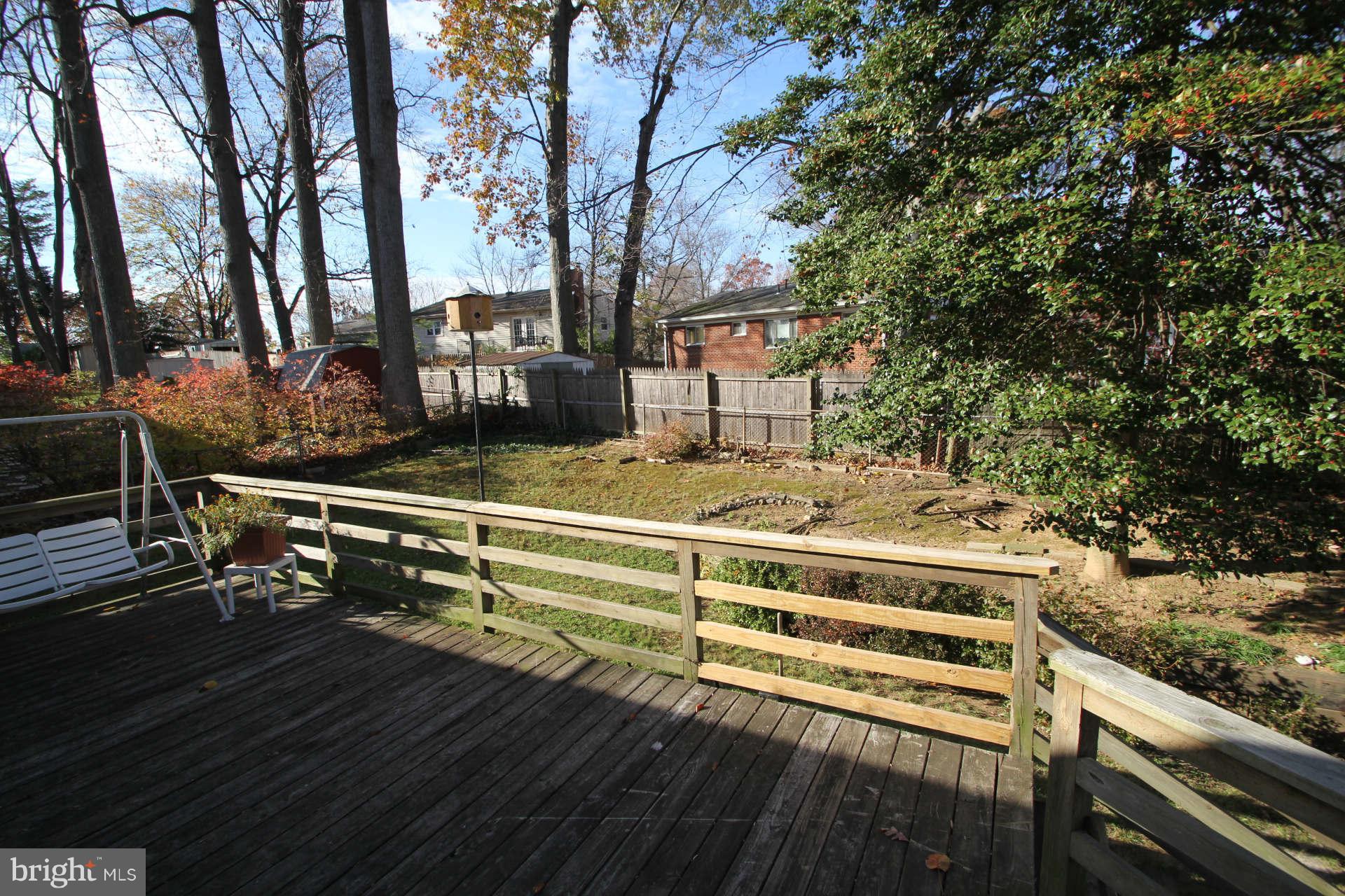 3811 Kayson Street Silver Spring, MD 20906 - Photo 27 of 30 a view of a wooden deck with chairs