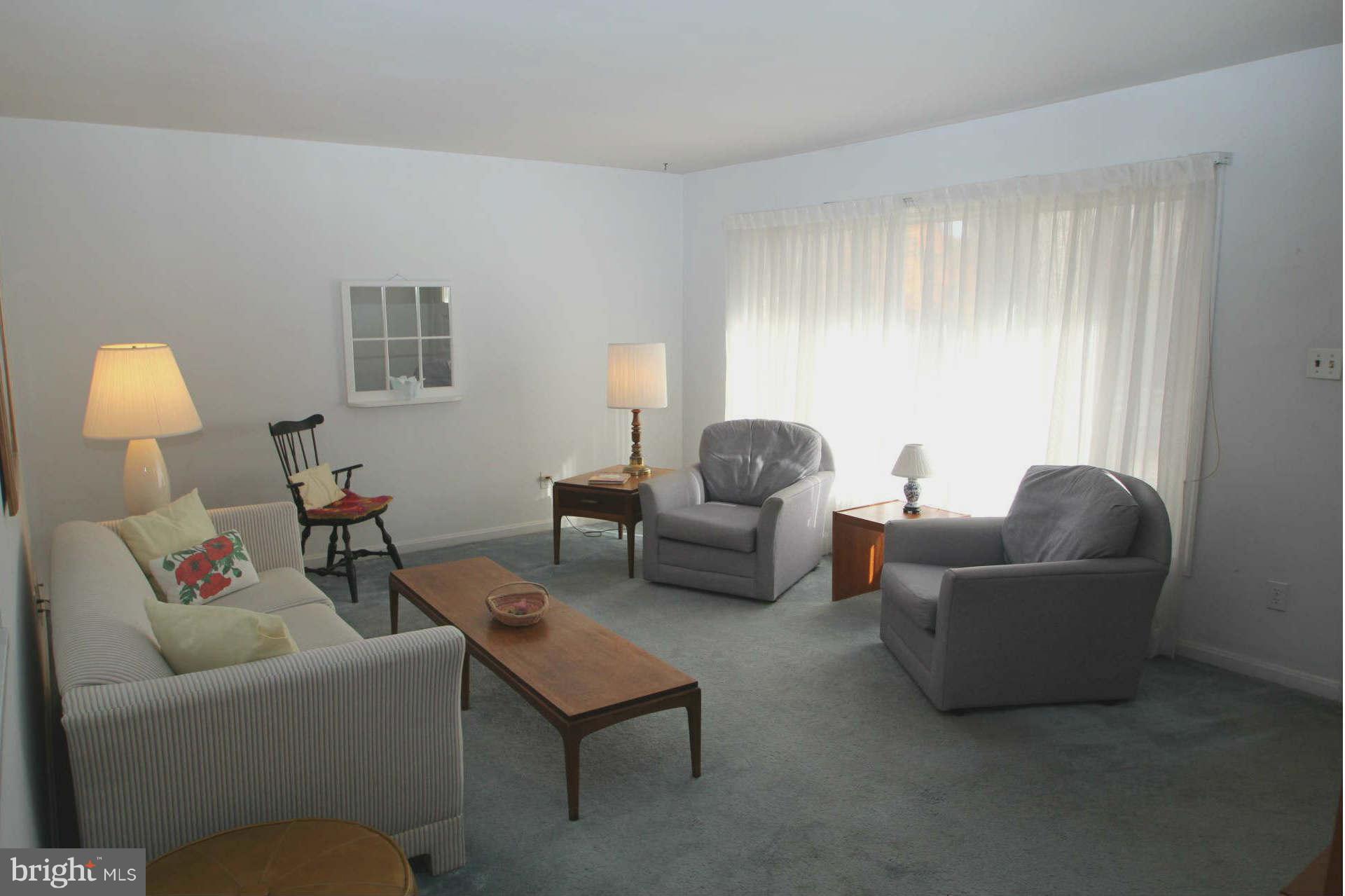 3811 Kayson Street Silver Spring, MD 20906 - Photo 4 of 30 a living room with furniture and a window