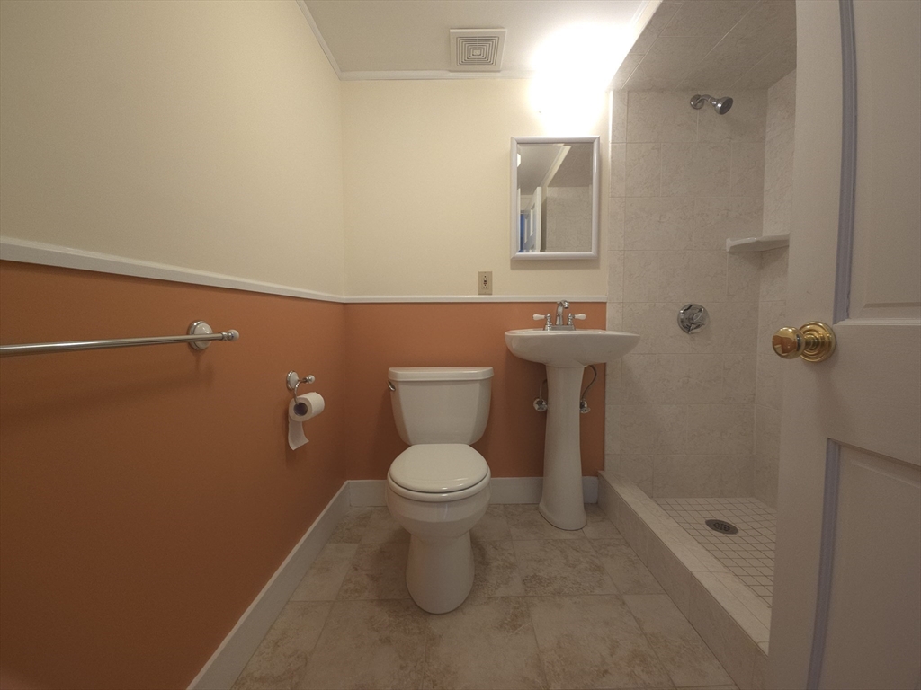 75 Charles Street, Unit 4B Boston, MA 02114 - Photo 12 of 14 a bathroom with a toilet and a shower
