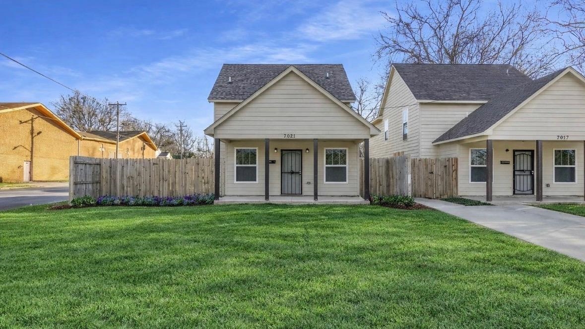 Bungalow-style house featuring roof with shingles