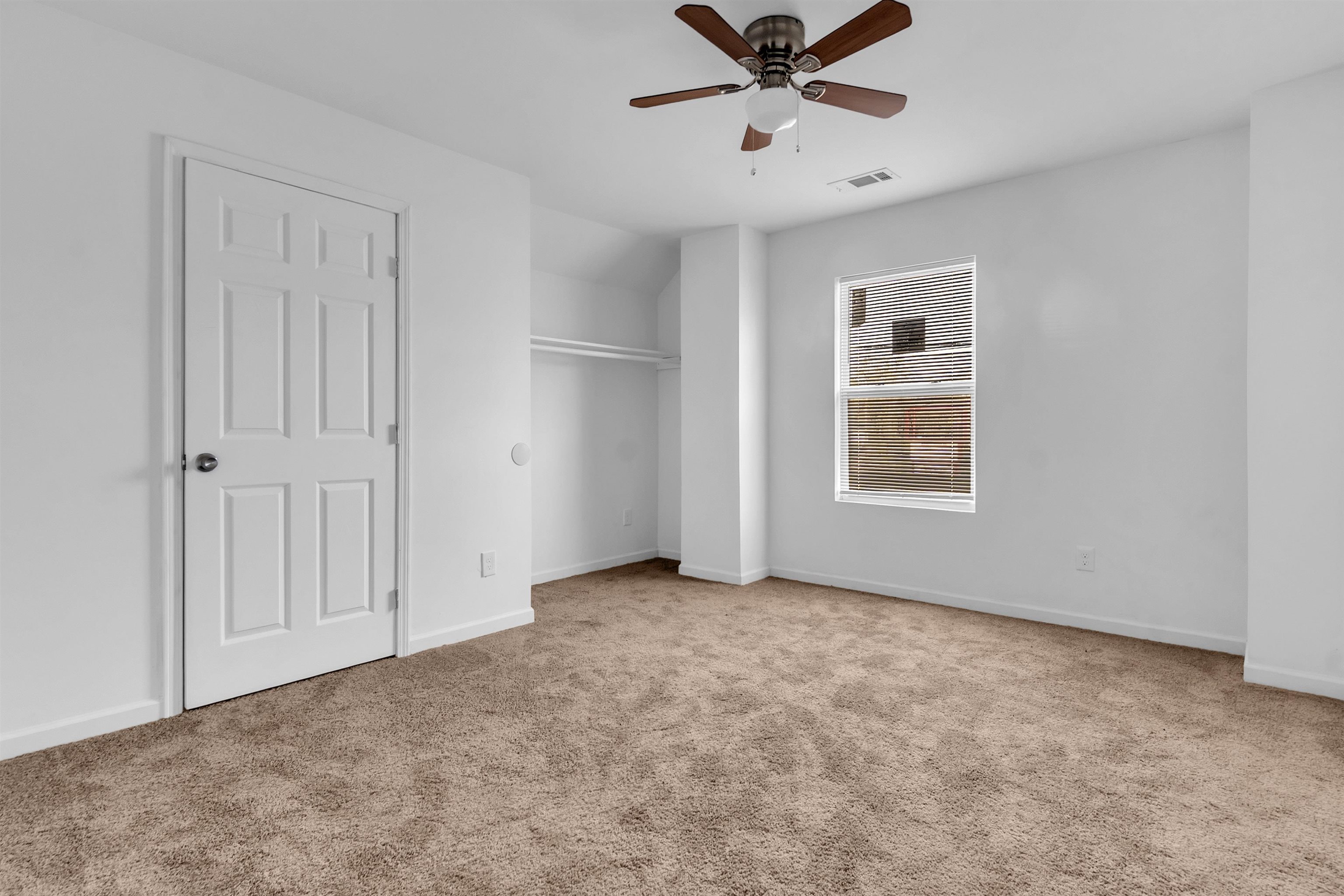 3021 Chelsea Avenue Memphis, TN 38108 - Photo 12 of 17 Unfurnished bedroom featuring light colored carpet and a ceiling fan