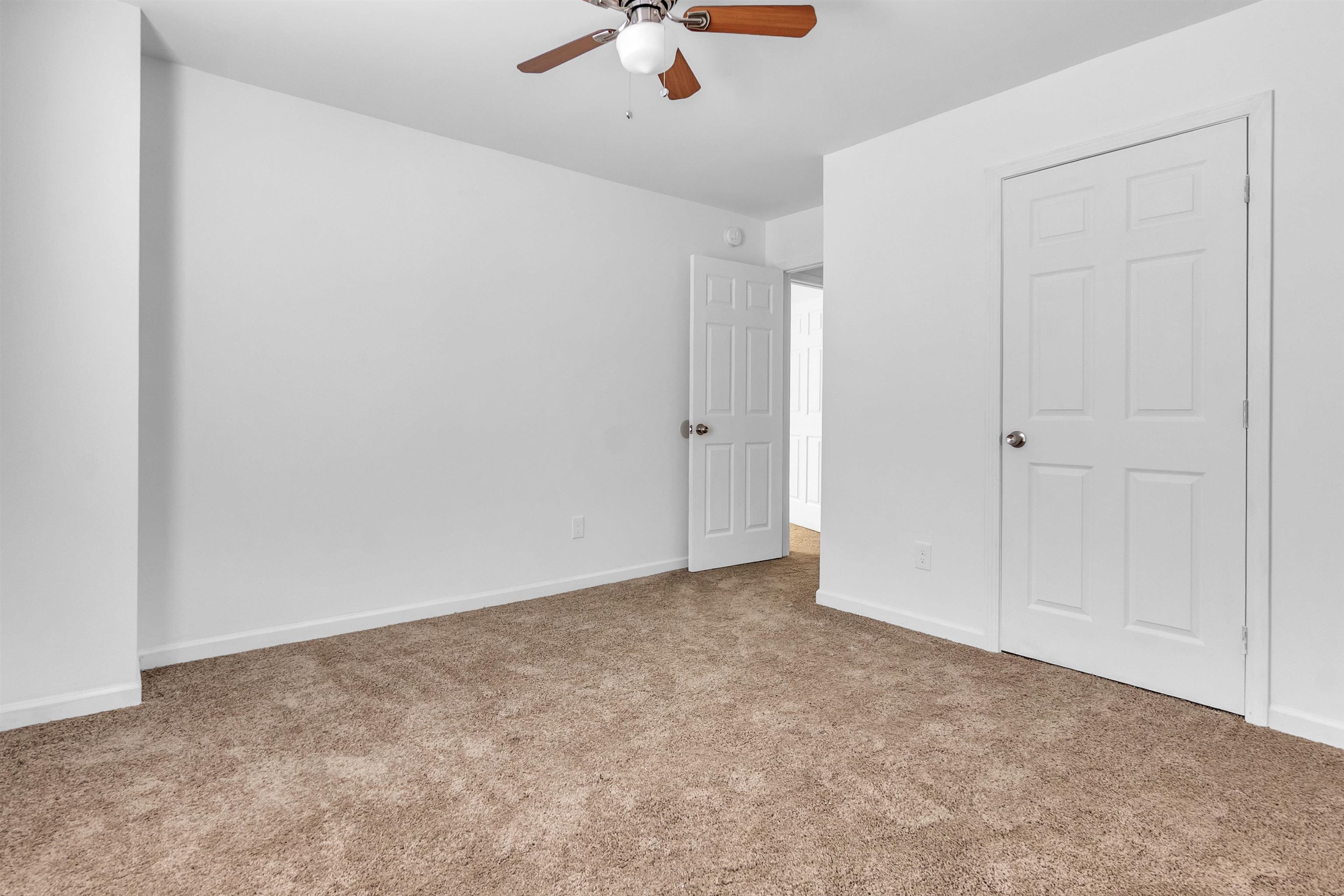 3021 Chelsea Avenue Memphis, TN 38108 - Photo 14 of 17 Unfurnished bedroom featuring light colored carpet and a ceiling fan