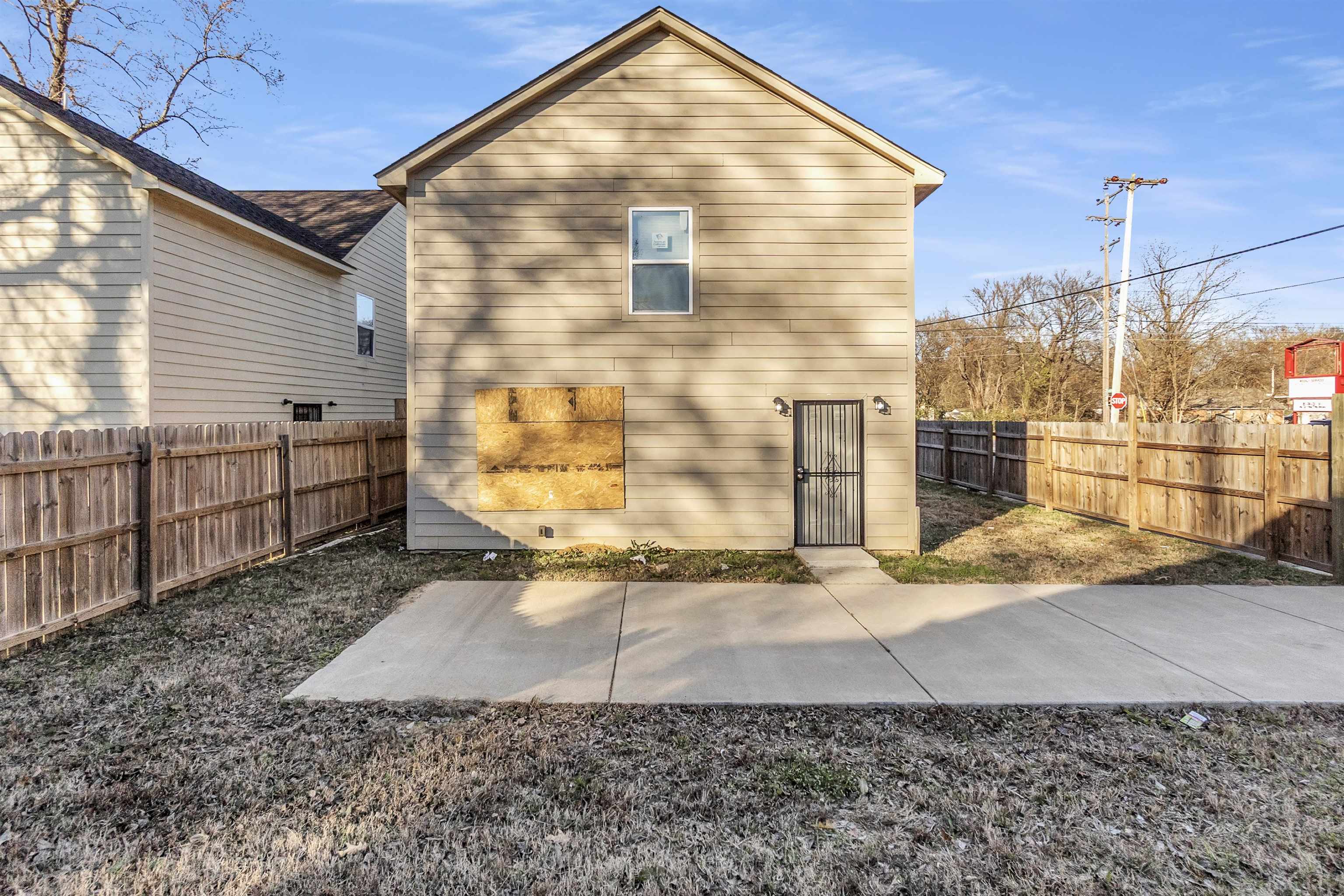 3021 Chelsea Avenue Memphis, TN 38108 - Photo 17 of 17 Rear view of house with a fenced backyard