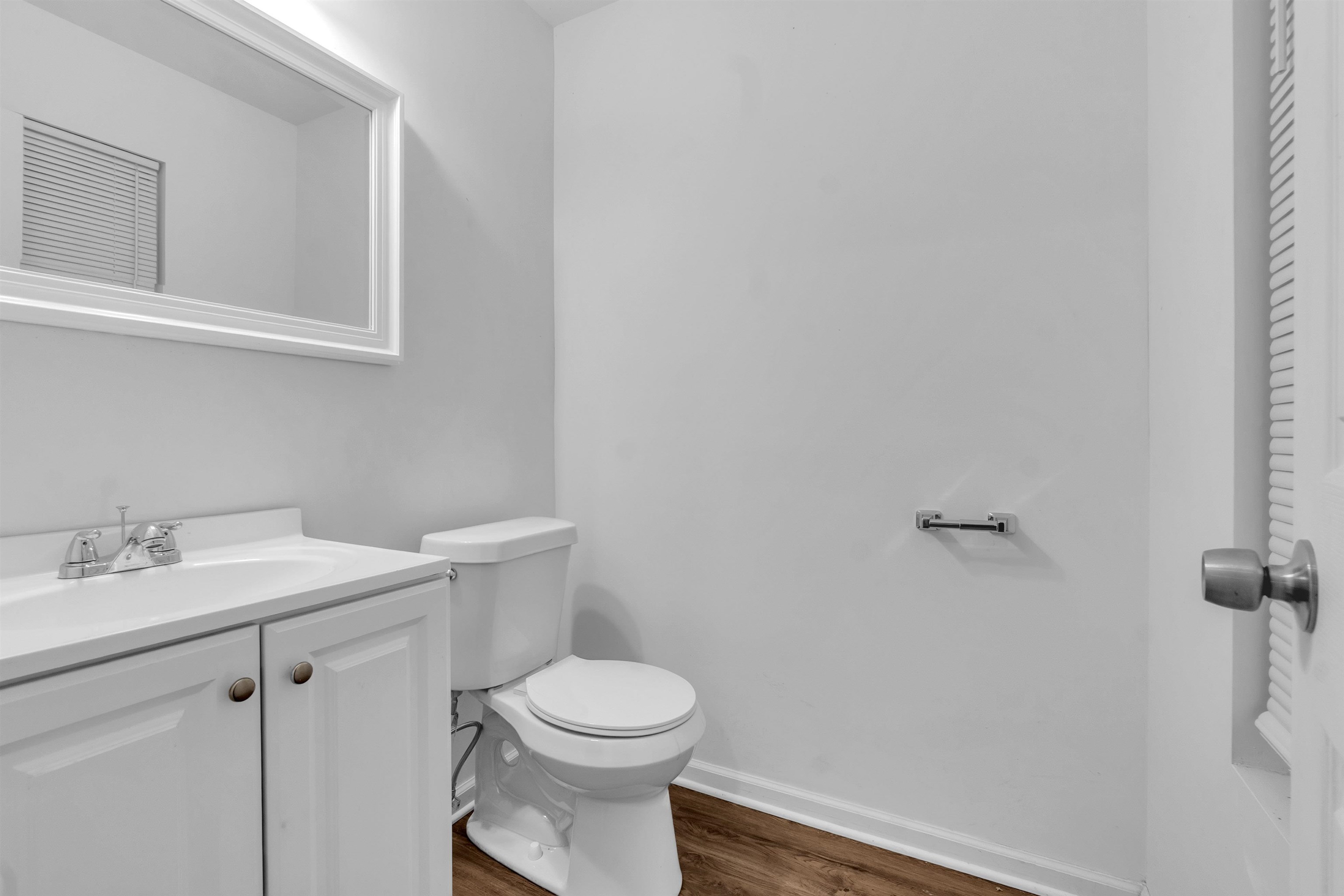 3021 Chelsea Avenue Memphis, TN 38108 - Photo 3 of 17 Bathroom with vanity and dark wood-style flooring