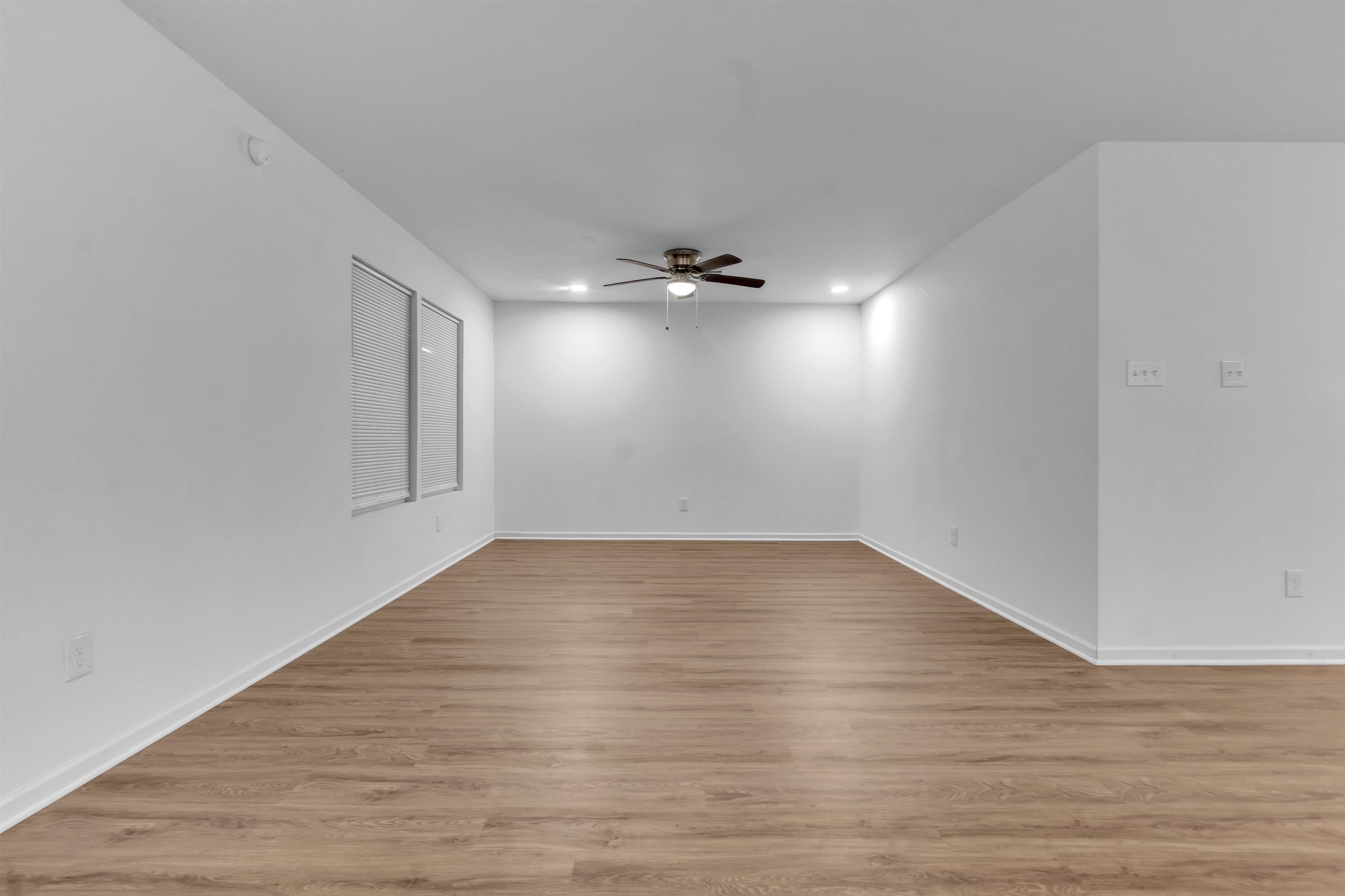 3021 Chelsea Avenue Memphis, TN 38108 - Photo 10 of 17 Spare room featuring light wood finished floors, a ceiling fan, and recessed lighting
