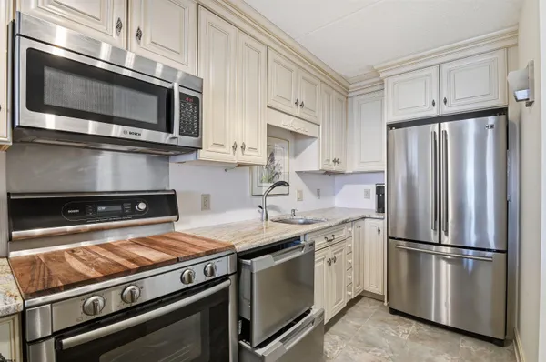 a kitchen with a stove microwave and refrigerator