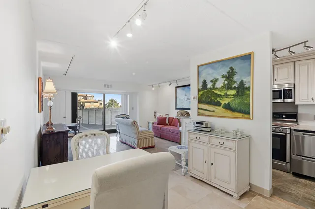 a living room with furniture and flat screen tv