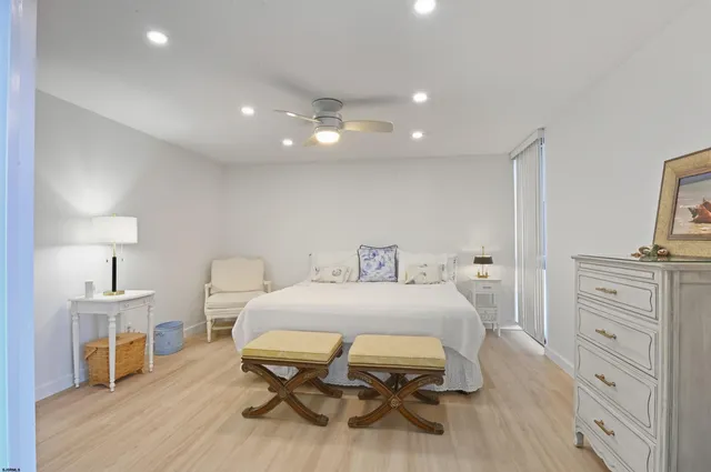 a bedroom with a bed and a table