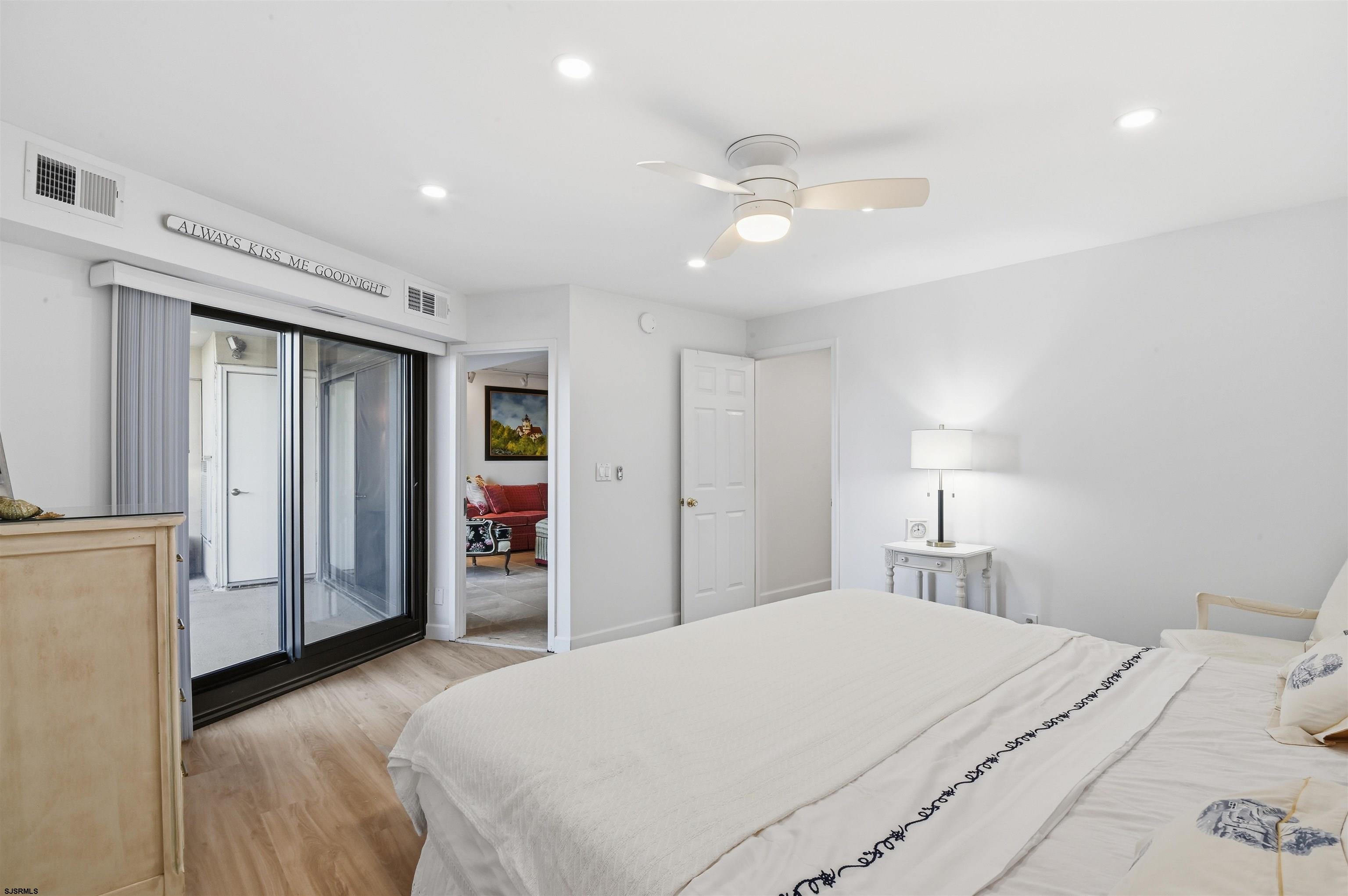 2700 Atlantic Avenue, Unit 209 Longport, NJ 08403 - Photo 20 of 31 a bed room with a bed and a lamp