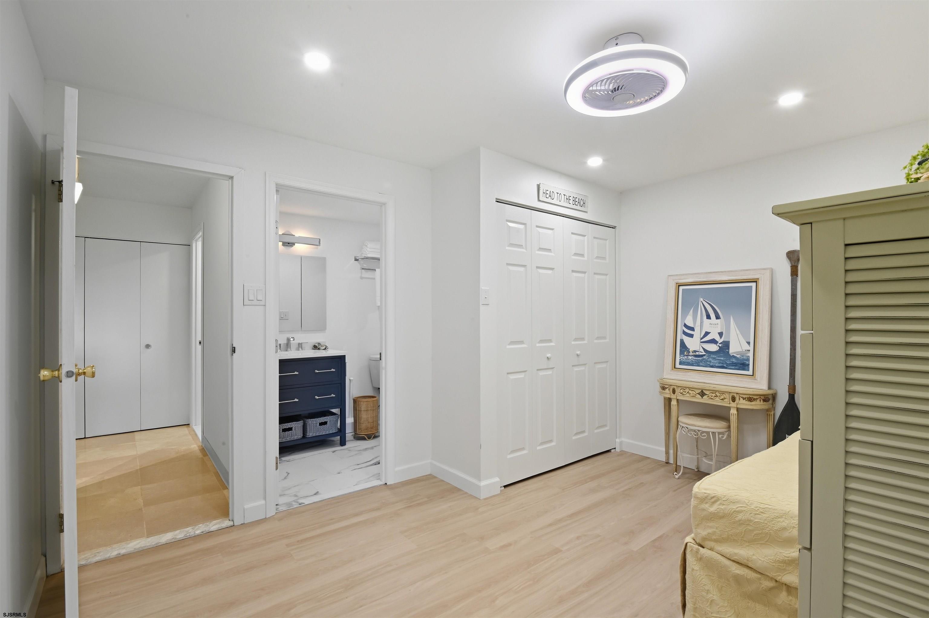 2700 Atlantic Avenue, Unit 209 Longport, NJ 08403 - Photo 22 of 31 wooden floor and windows in a room