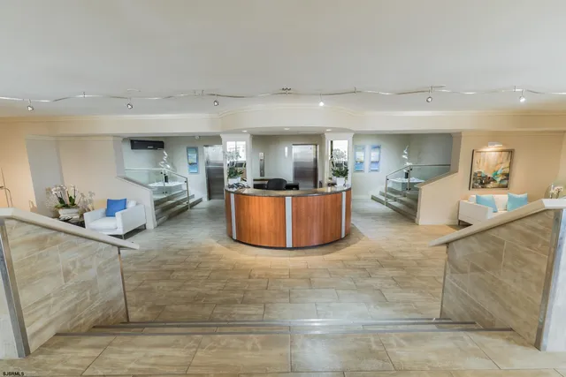 a view of a living room and kitchen