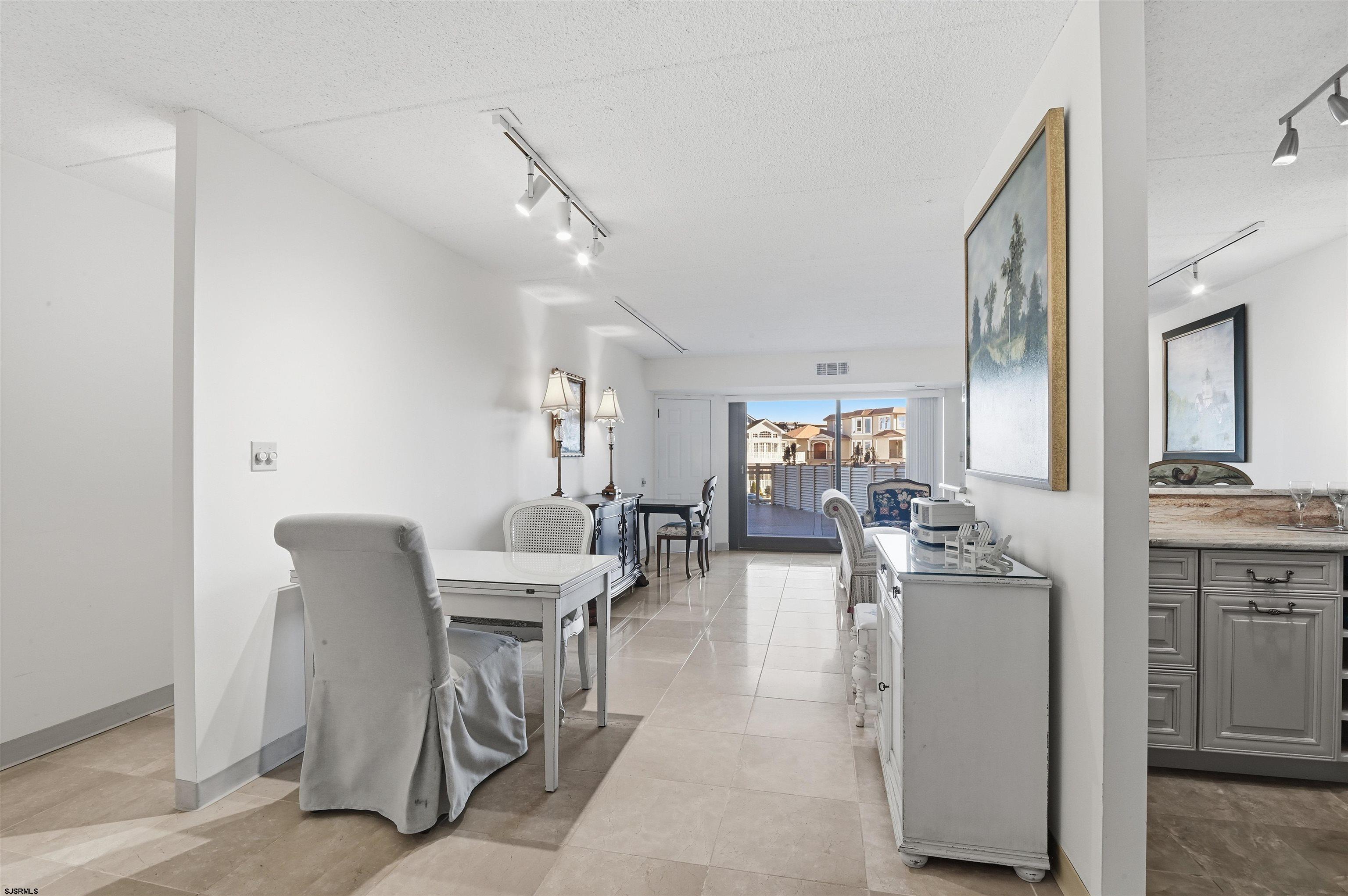 2700 Atlantic Avenue, Unit 209 Longport, NJ 08403 - Photo 8 of 31 a view of a dining room with furniture
