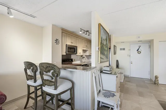 a view of a livingroom with furniture and a flat screen tv
