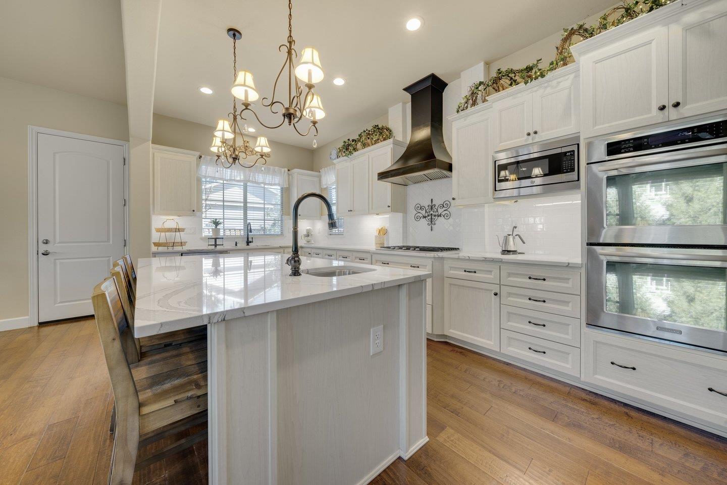 3943 Vía Cristobal Campbell, CA 95008 - Photo 13 of 59 a kitchen with stainless steel appliances a sink stove and cabinets