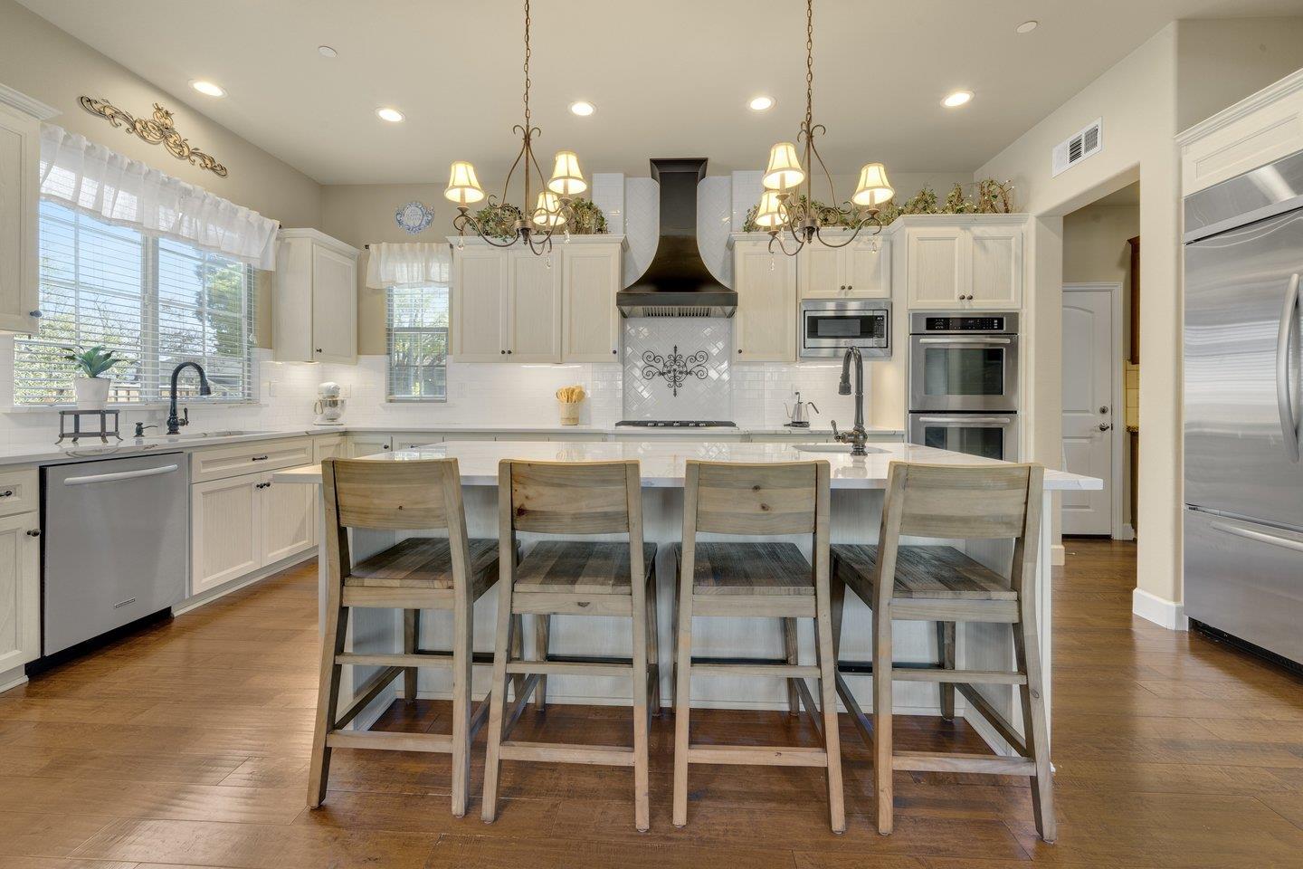 3943 Vía Cristobal Campbell, CA 95008 - Photo 14 of 59 a large kitchen with a table and chairs