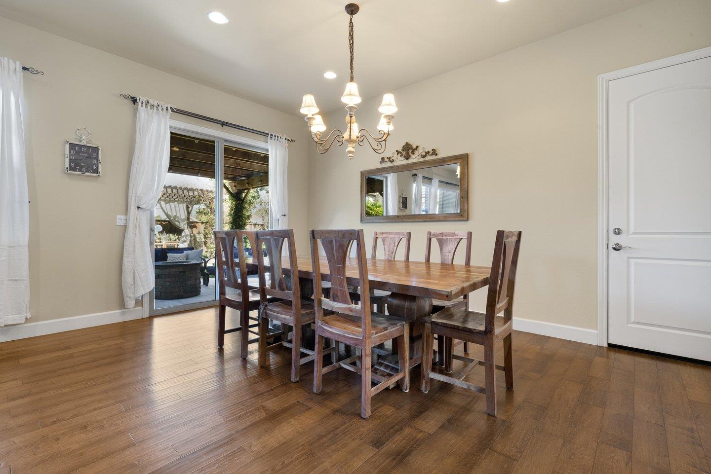 3943 Vía Cristobal Campbell, CA 95008 - Photo 21 of 59 a view of a dining room with furniture wooden floor and chandelier