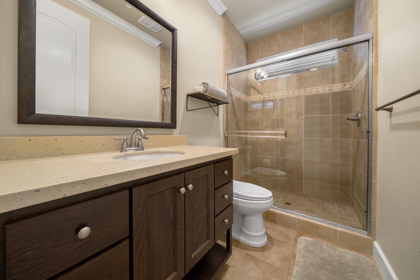 3943 Vía Cristobal Campbell, CA 95008 - Photo 28 of 59 a bathroom with a sink a toilet a mirror and shower