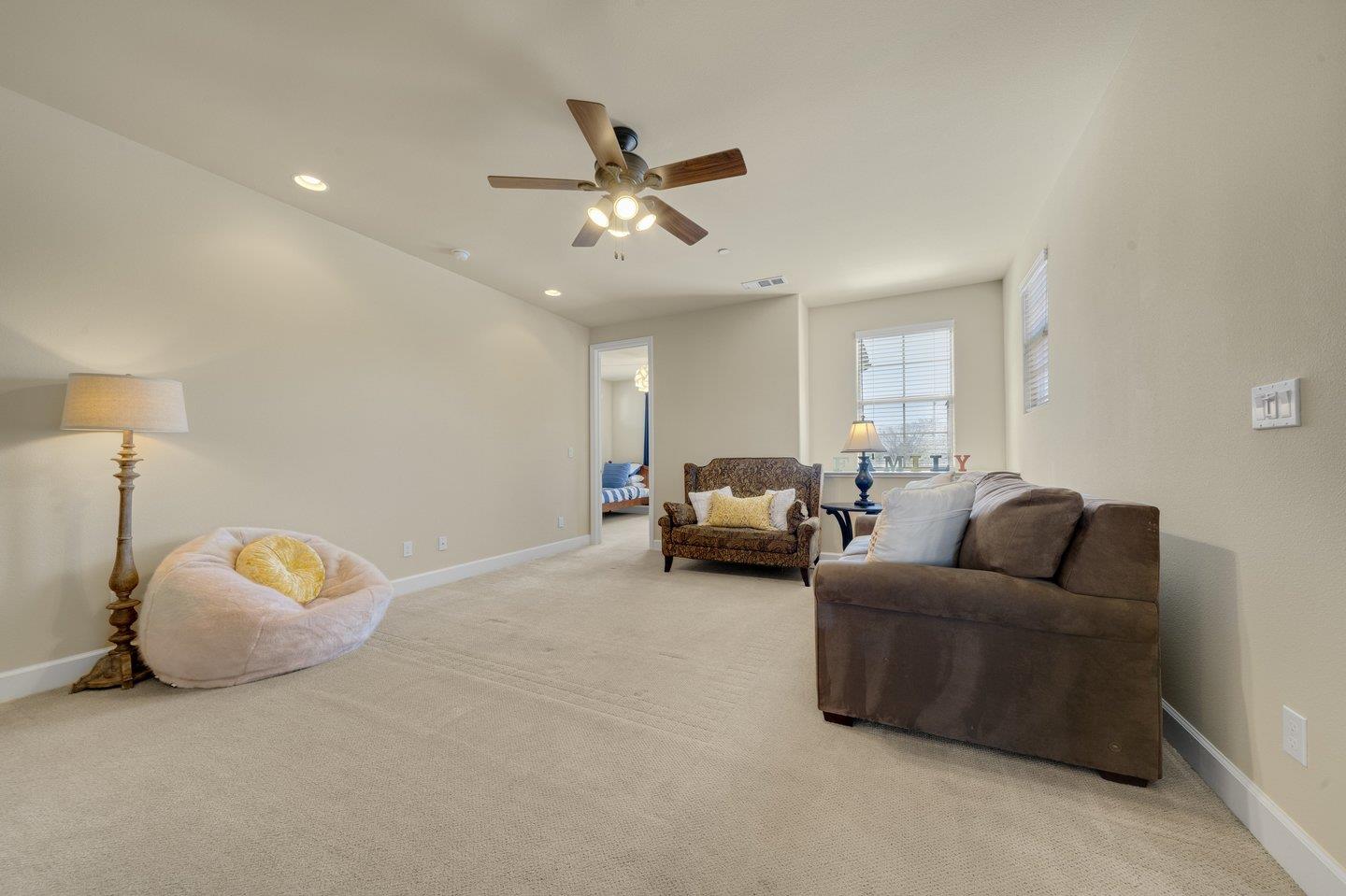 3943 Vía Cristobal Campbell, CA 95008 - Photo 29 of 59 a living room with furniture and a chandelier