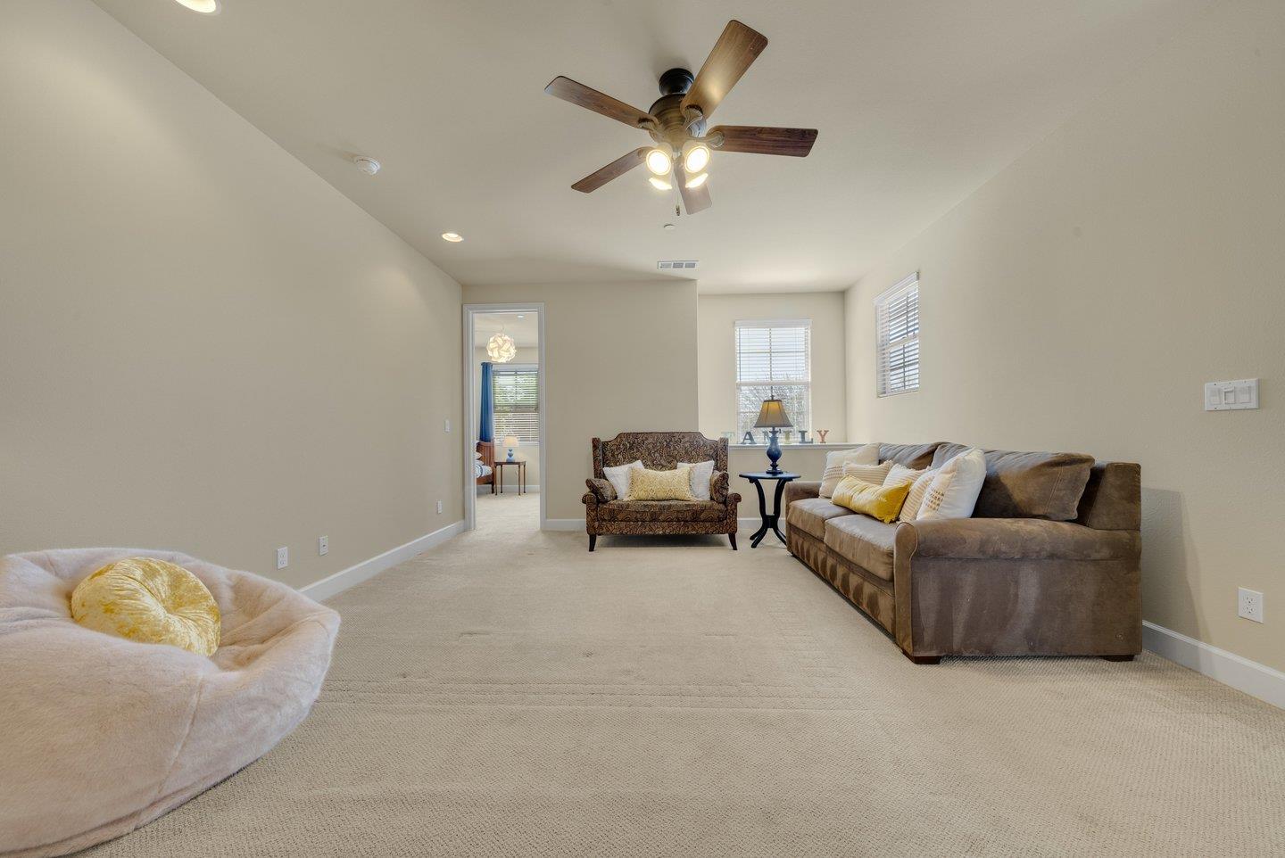 3943 Vía Cristobal Campbell, CA 95008 - Photo 31 of 59 a living room with furniture and a ceiling fan