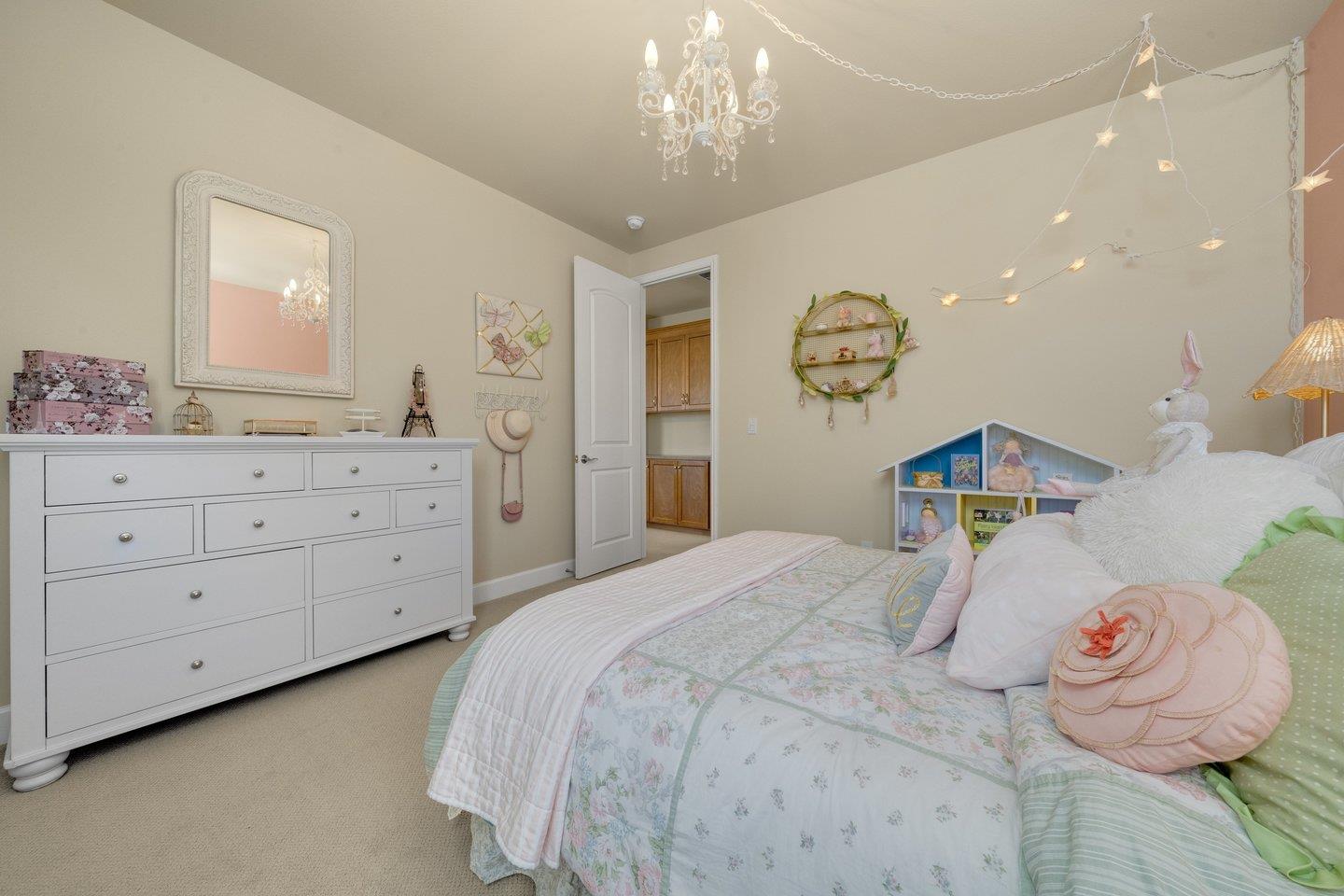 3943 Vía Cristobal Campbell, CA 95008 - Photo 35 of 59 a bedroom with a bed and a chandelier