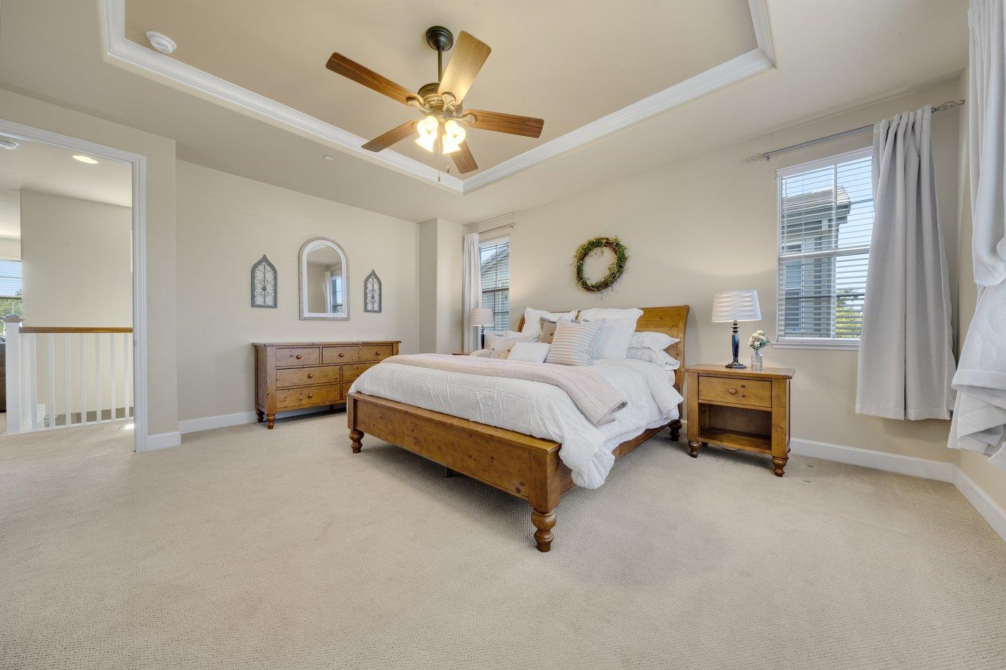 3943 Vía Cristobal Campbell, CA 95008 - Photo 41 of 59 a bedroom with a bed and a chandelier