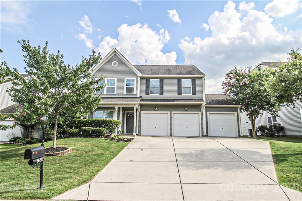 7042 Meyer Road Fort Mill, SC 29715 - Photo 1 of 18 a house view with a garden space