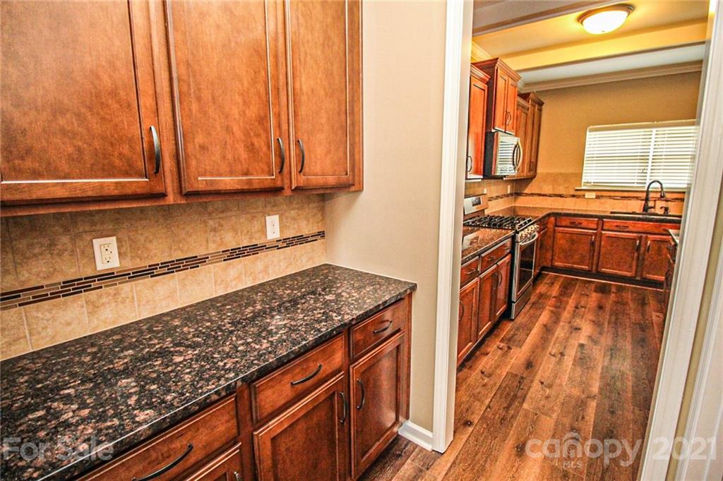7042 Meyer Road Fort Mill, SC 29715 - Photo 5 of 18 a view of a kitchen with a sink and cabinets
