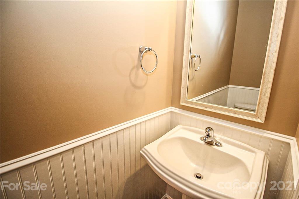 7042 Meyer Road Fort Mill, SC 29715 - Photo 9 of 18 a bathroom with a sink and vanity