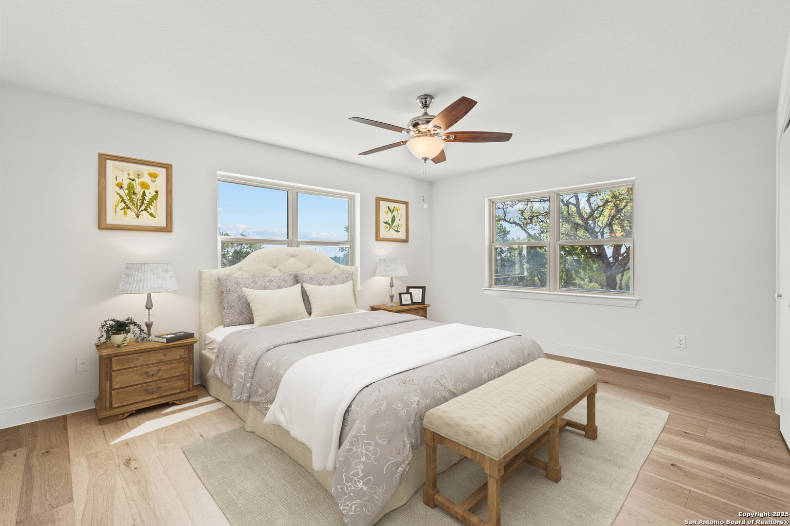 935 Spring Branch Road Spring Branch, TX 78070 - Photo 15 of 48 a spacious bedroom with a bed and a painting on the wall