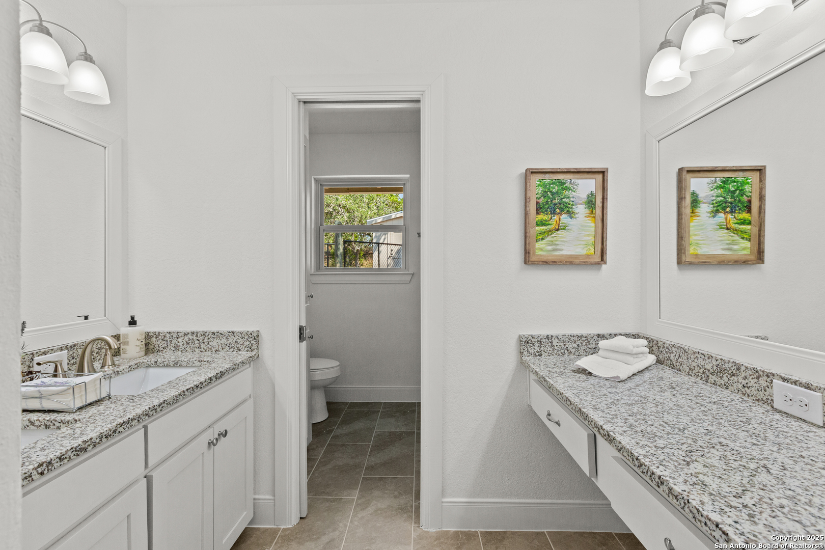 935 Spring Branch Road Spring Branch, TX 78070 - Photo 20 of 48 a bathroom with a granite countertop sink and a mirror
