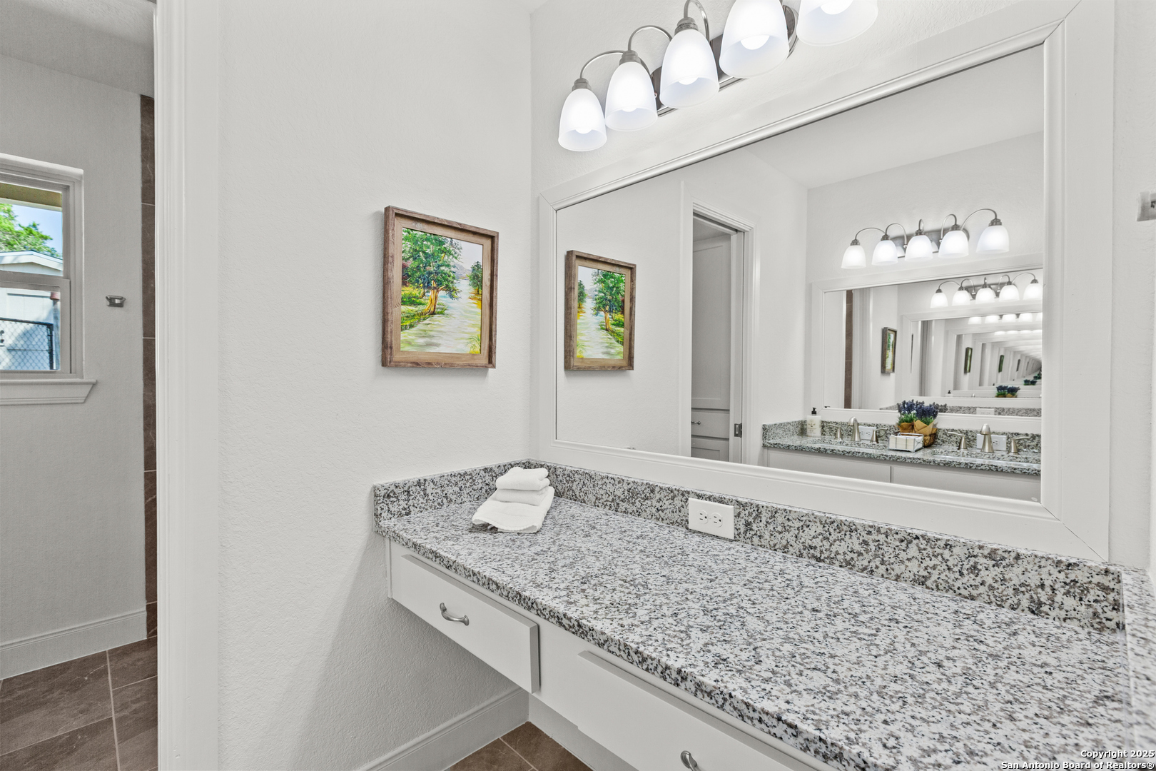 935 Spring Branch Road Spring Branch, TX 78070 - Photo 21 of 48 a bathroom with a granite countertop sink and a mirror