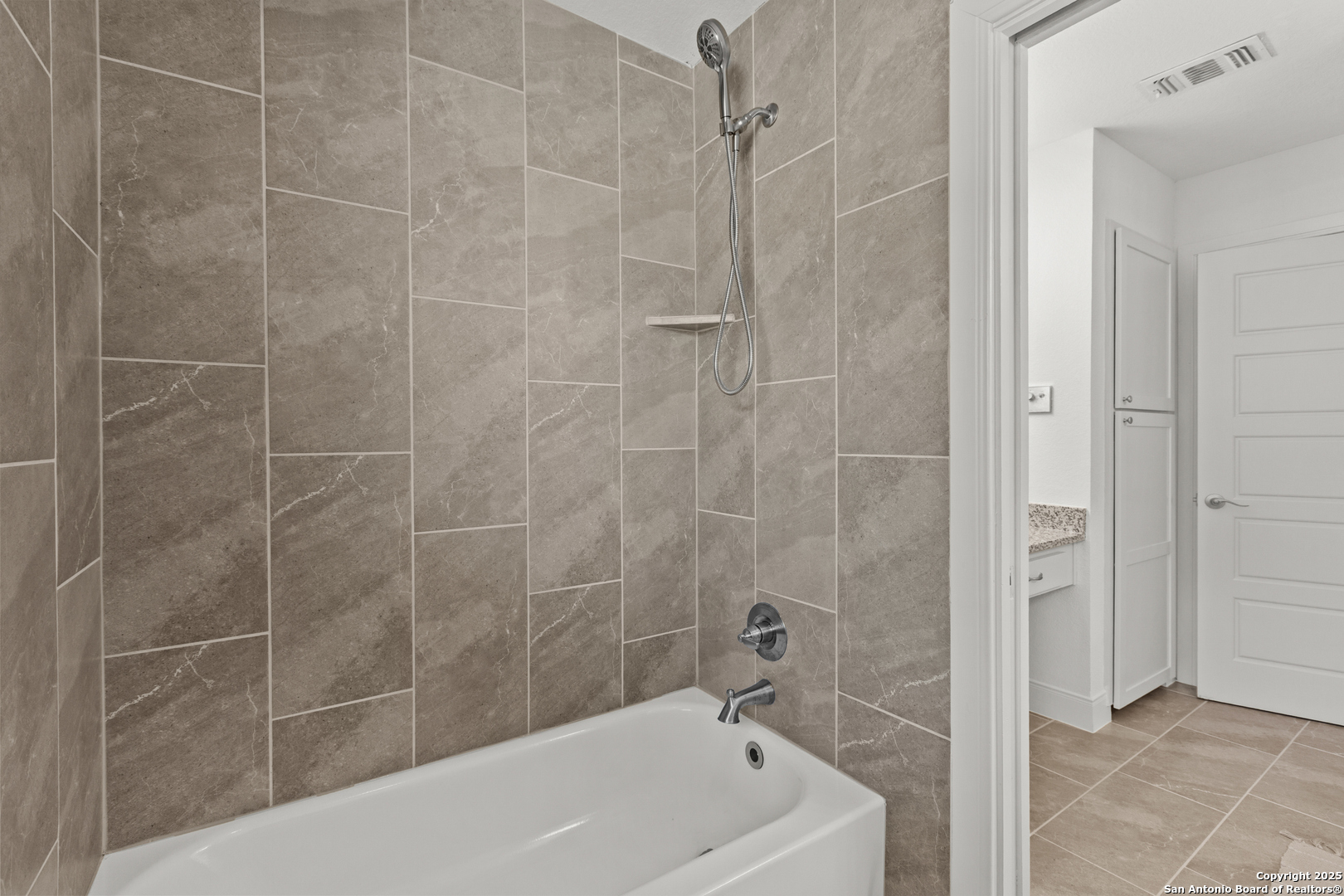 935 Spring Branch Road Spring Branch, TX 78070 - Photo 22 of 48 a bathroom with a bathtub and shower