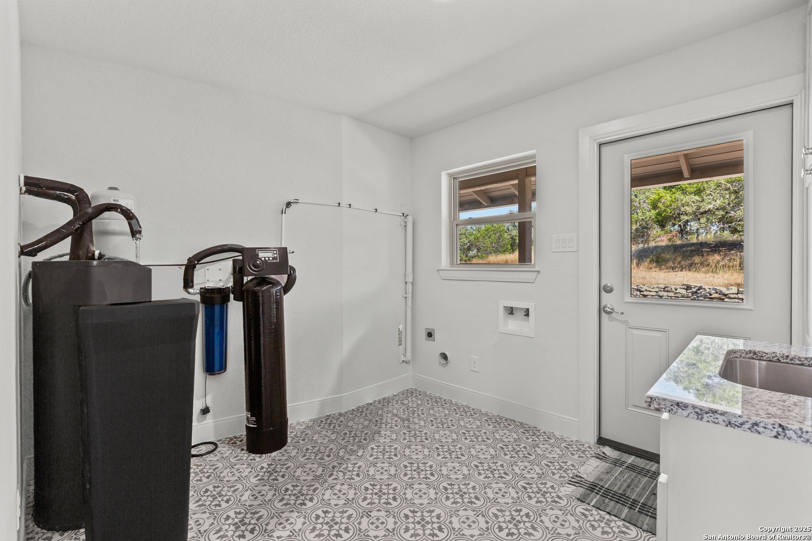 935 Spring Branch Road Spring Branch, TX 78070 - Photo 24 of 48 a view of a storage & utility room with a sink