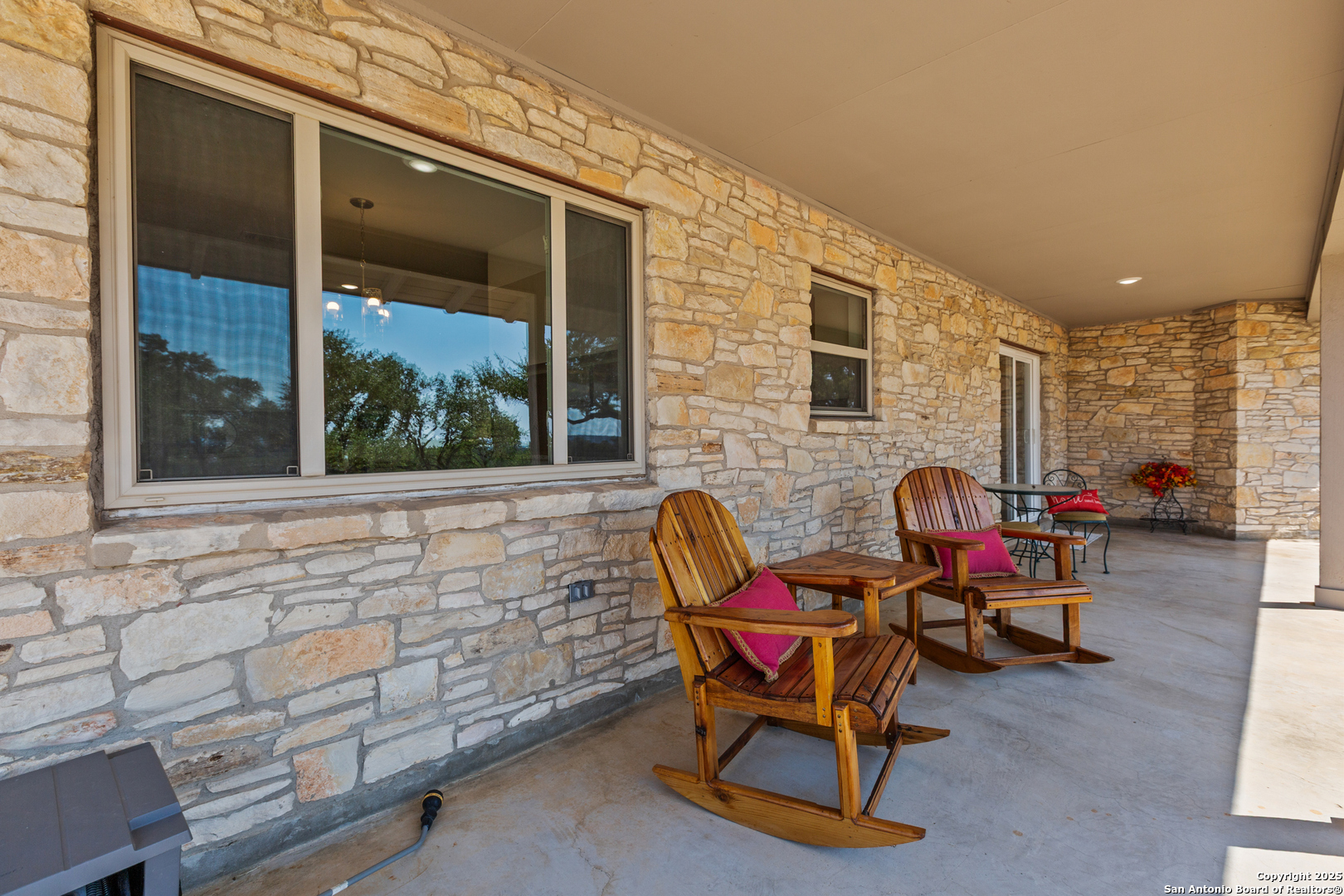 935 Spring Branch Road Spring Branch, TX 78070 - Photo 29 of 48 a backyard of a house with outdoor seating
