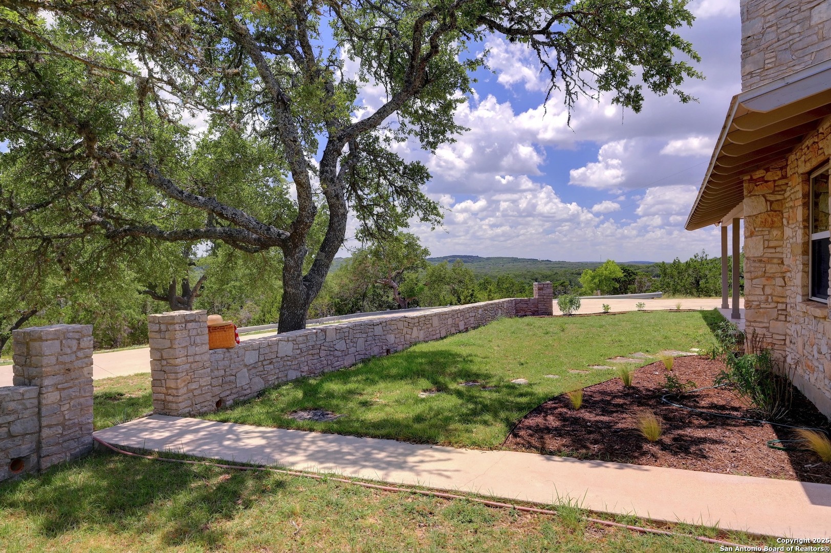 935 Spring Branch Road Spring Branch, TX 78070 - Photo 4 of 48 a view of a garden with a lake