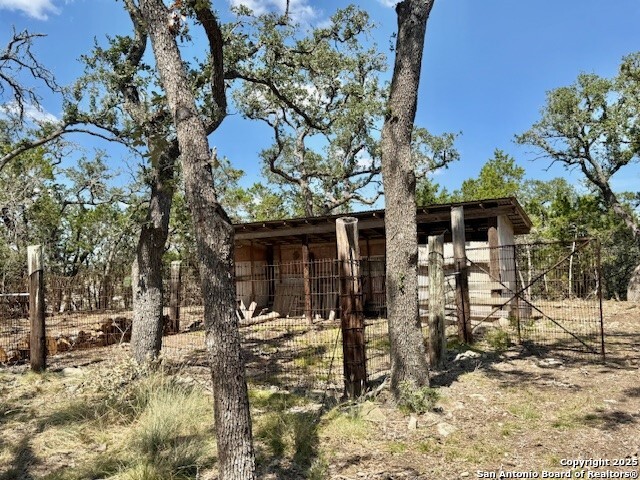 935 Spring Branch Road Spring Branch, TX 78070 - Photo 43 of 48 a front view of a house with a yard covered with snow