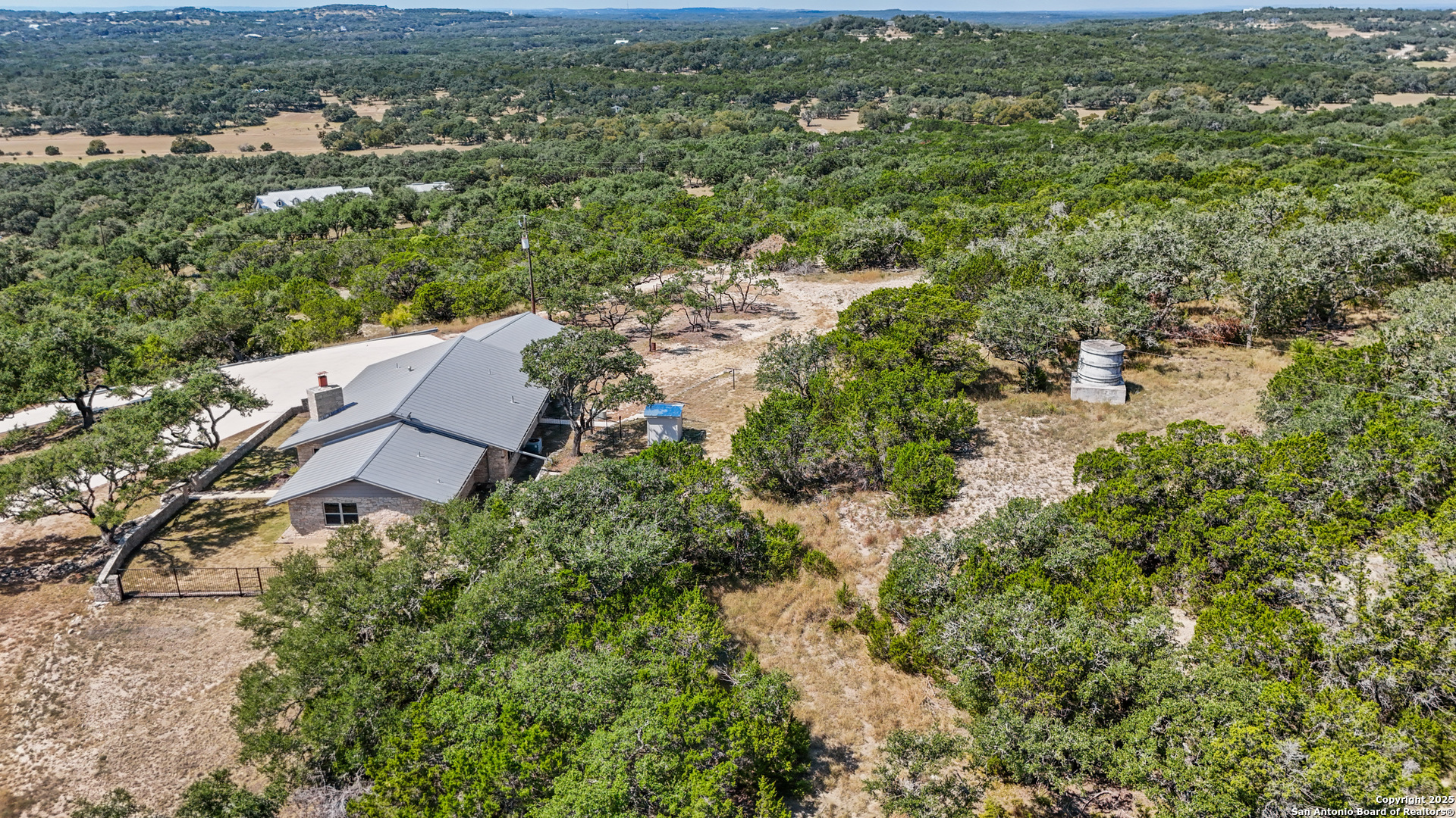 935 Spring Branch Road Spring Branch, TX 78070 - Photo 48 of 48 an aerial view of residential house with outdoor space and trees all around