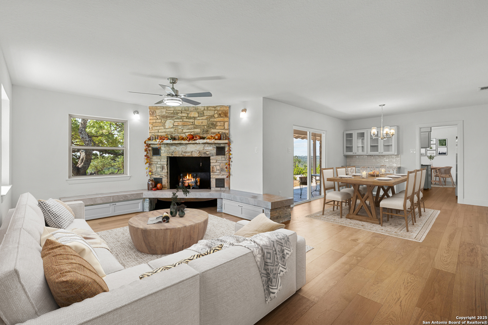 935 Spring Branch Road Spring Branch, TX 78070 - Photo 7 of 48 a living room with furniture and a fireplace